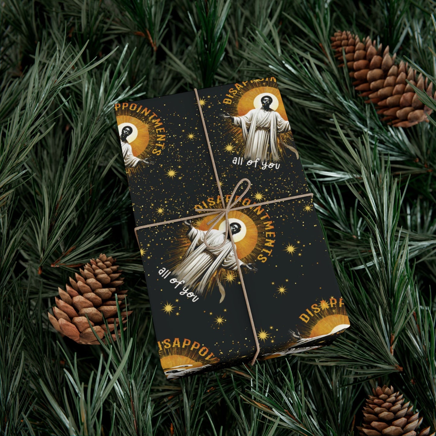 Gift wrapped in Black Jesus Disappointments All Of You Christmas Gift Wrap on pine branches, combining humor and festive style for holiday gifting.