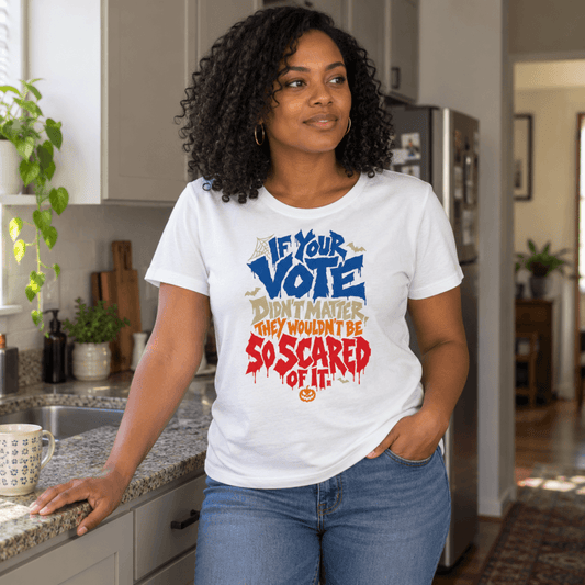 Woman in a kitchen wearing the white So Scared Of It women's relaxed t-shirt with jeans