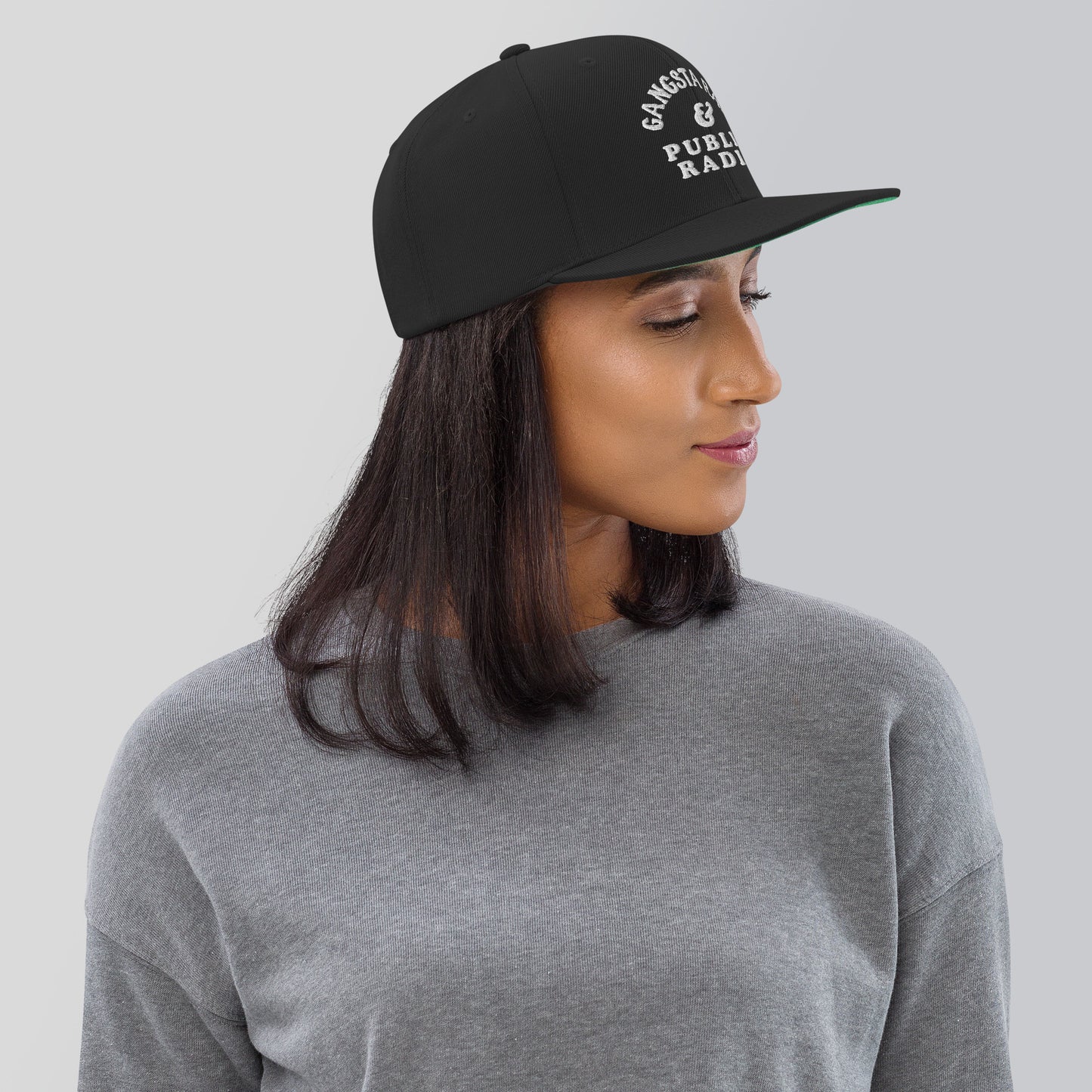 a woman wearing a black and white hat
