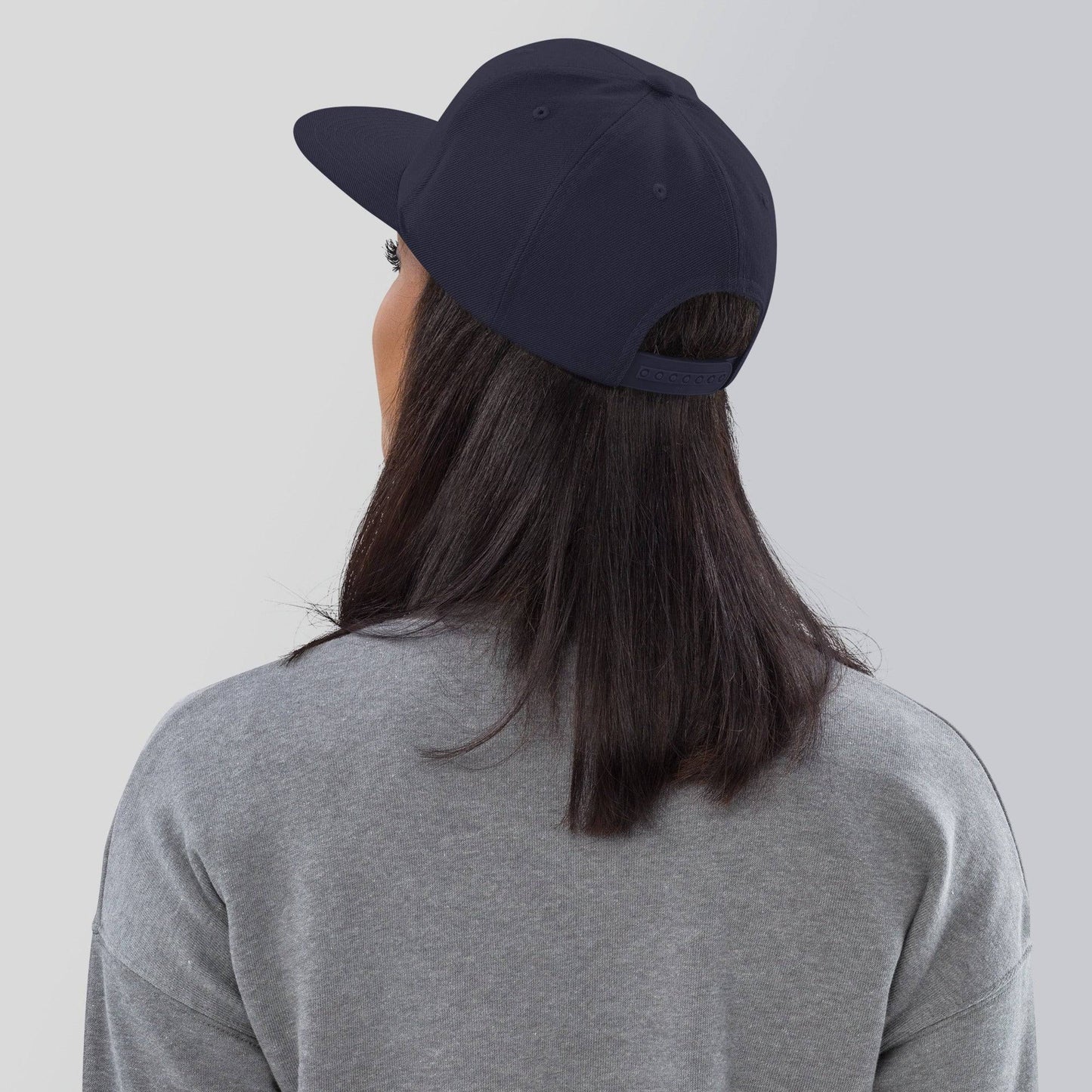 the back of a person wearing a hat
