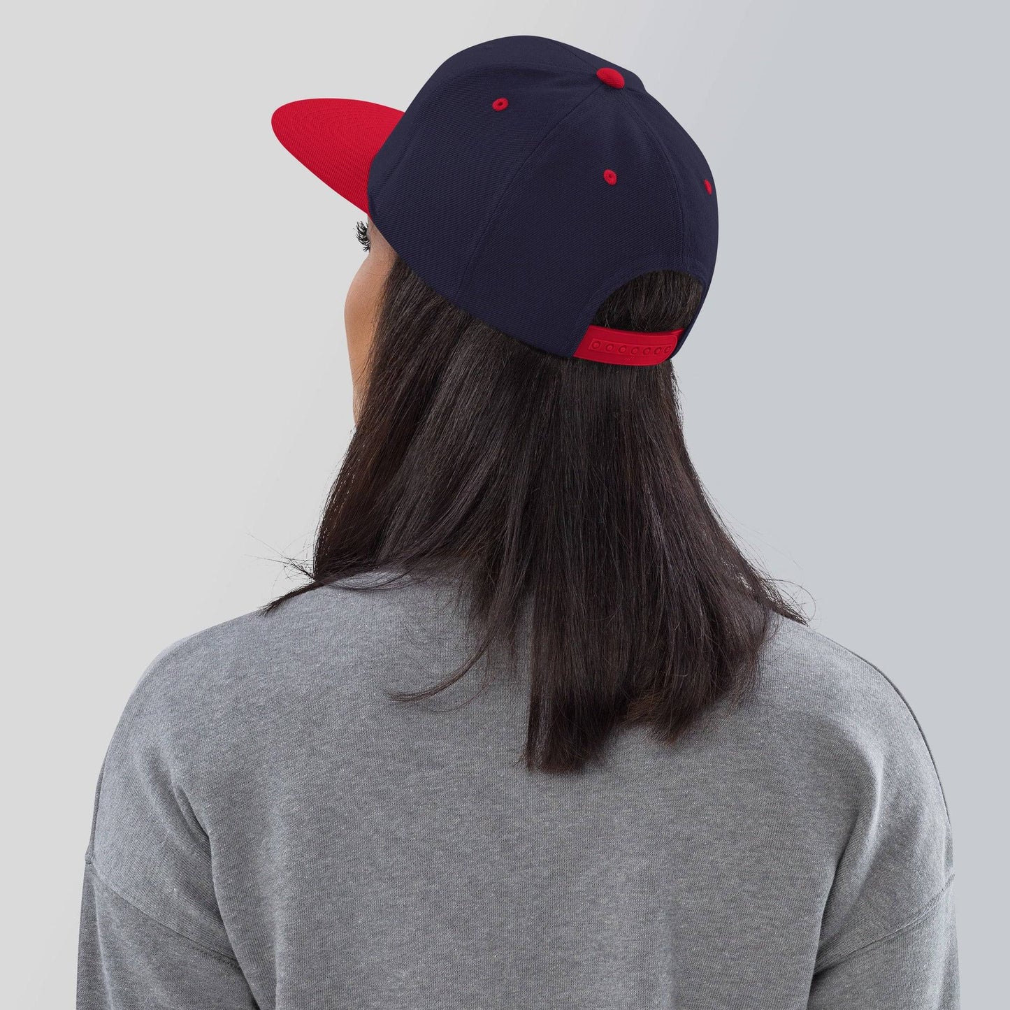the back of a person wearing a baseball cap