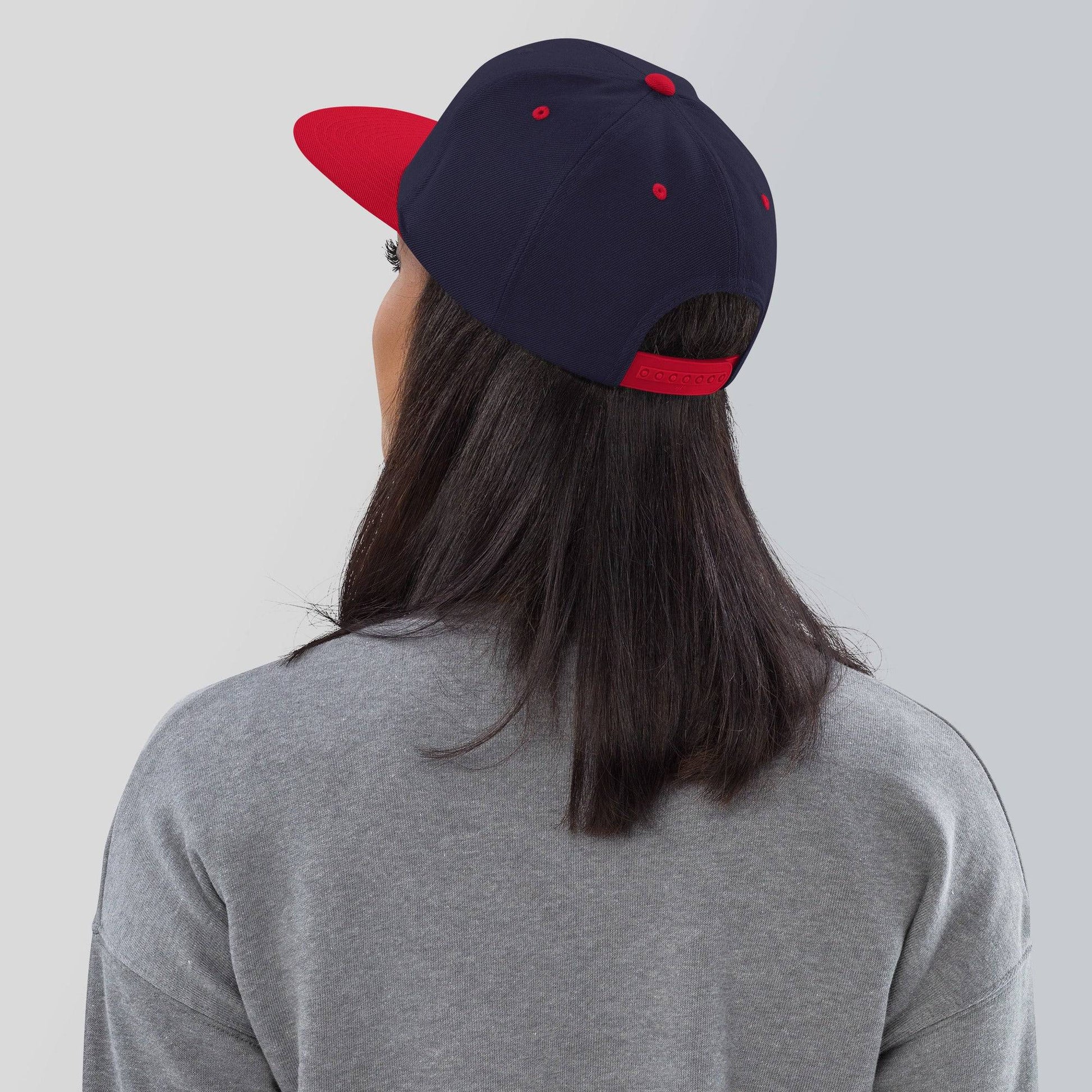 the back of a person wearing a baseball cap