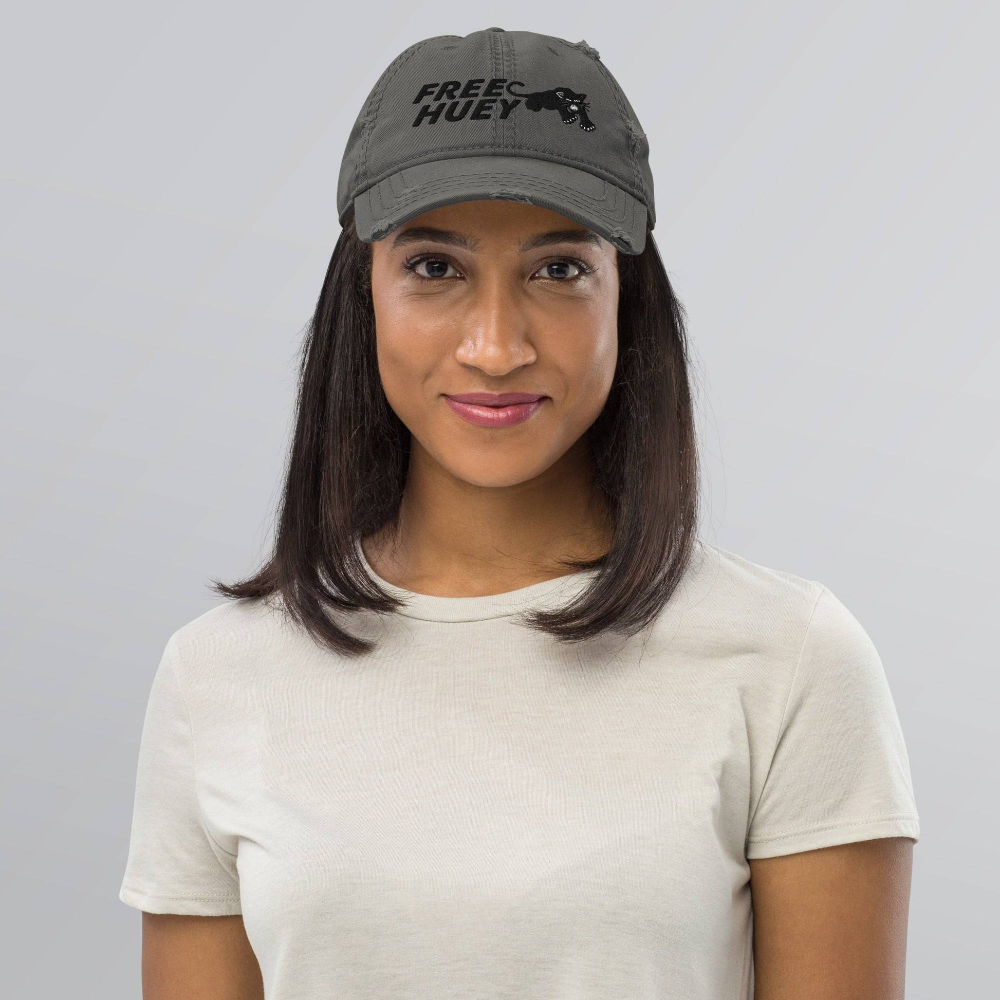 Woman wearing Free Huey Black Panther Party distressed hat
