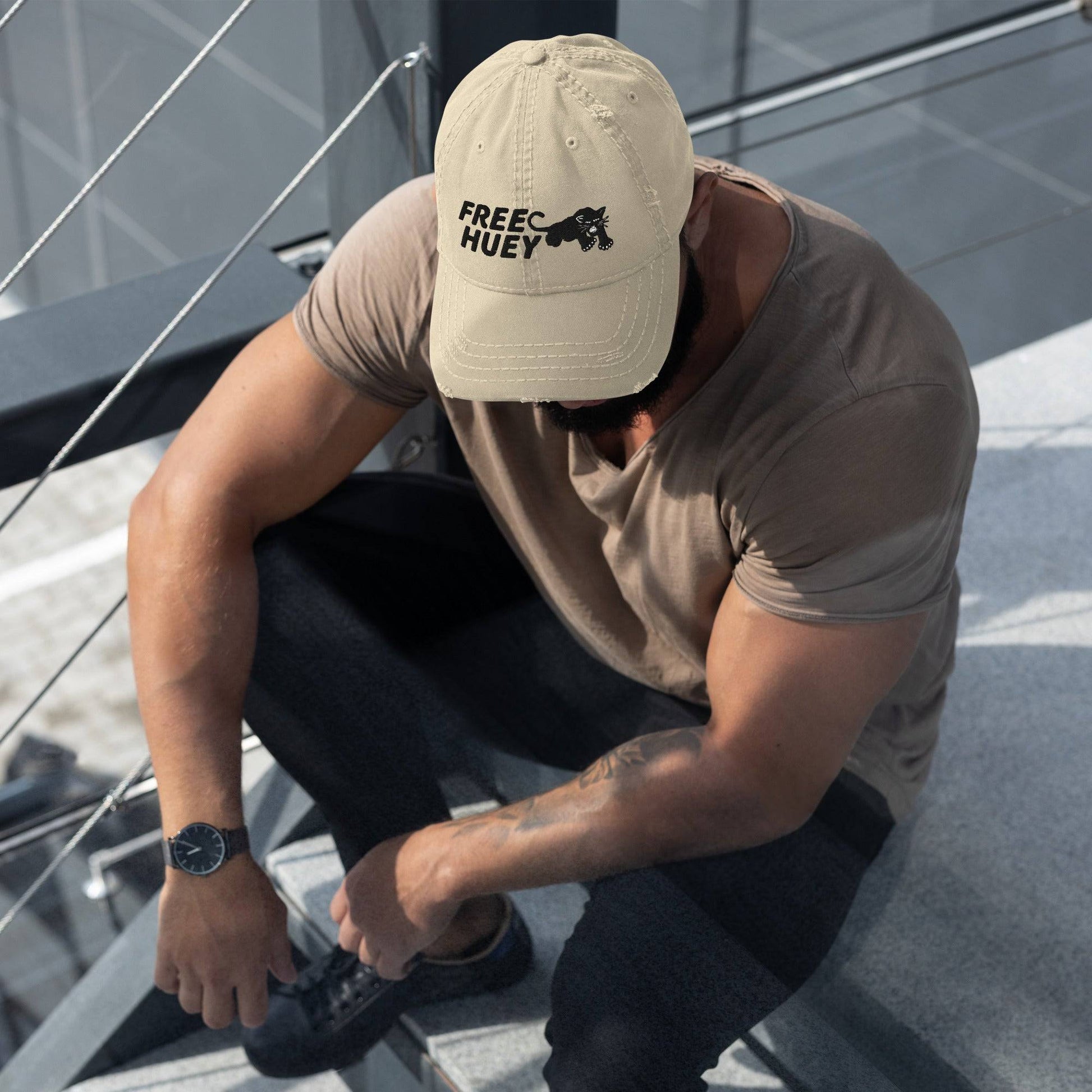 Man wearing Free Huey Black Panther Party distressed hat