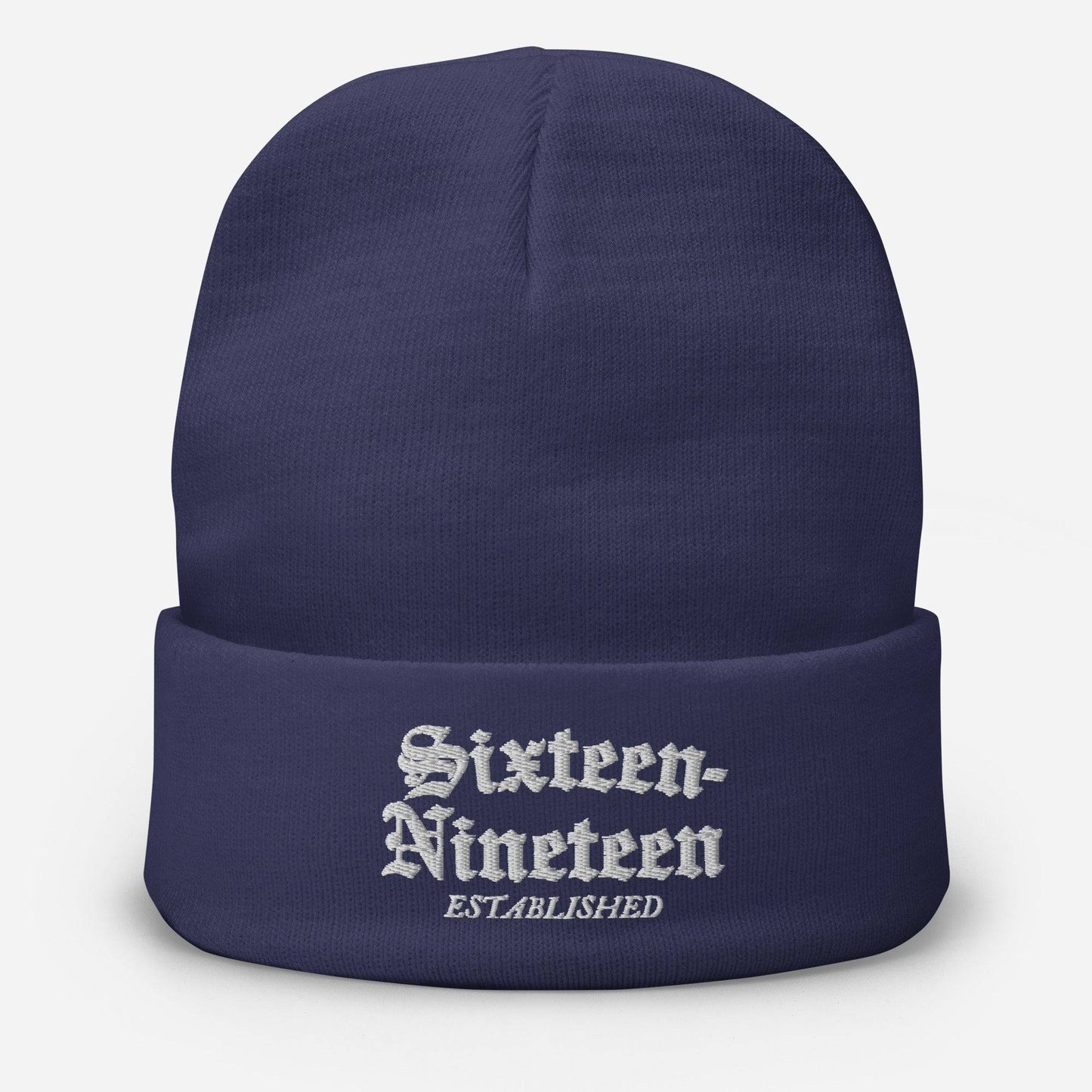 Sixteen-Nineteen Embroidered Beanie in navy blue with white embroidered text 'Sixteen-Nineteen Established.' Warm, form-fitting cotton blend hat.