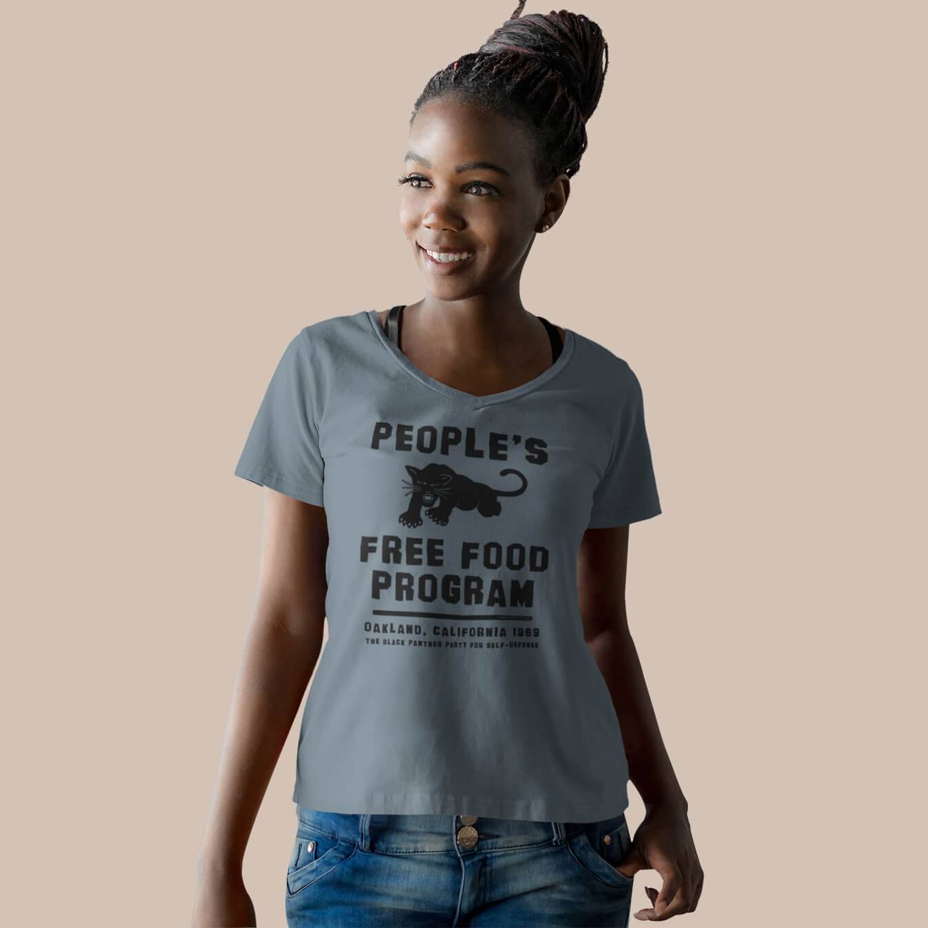 Woman wearing Black Panthers People's Free Food Program Women's V-neck Tee in heather blue, showcasing cultural pride and casual style.