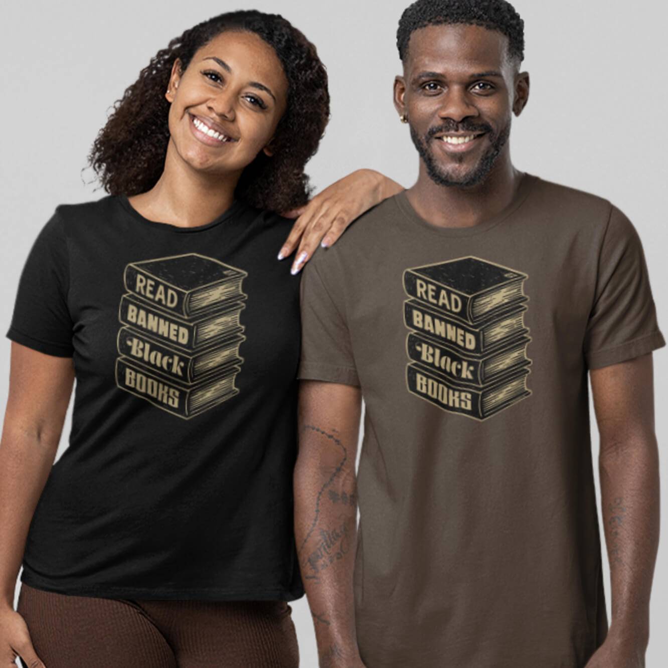 Models wearing Read Banned Black Books Stack Unisex T-Shirts by TheBlackest Co., showcasing activist apparel in black and brown color options.