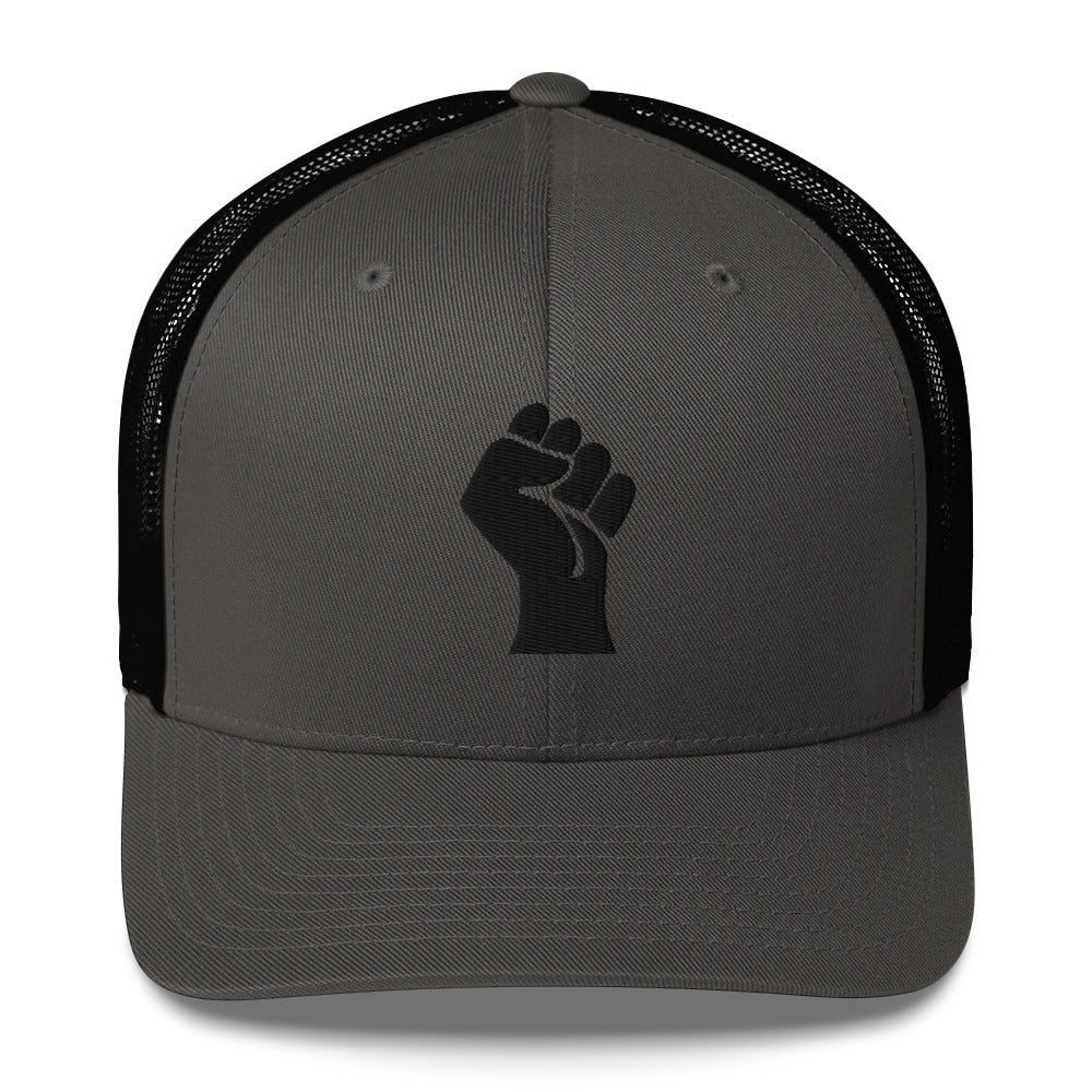 Front view of grey heather embroidered Black Power Fist trucker cap