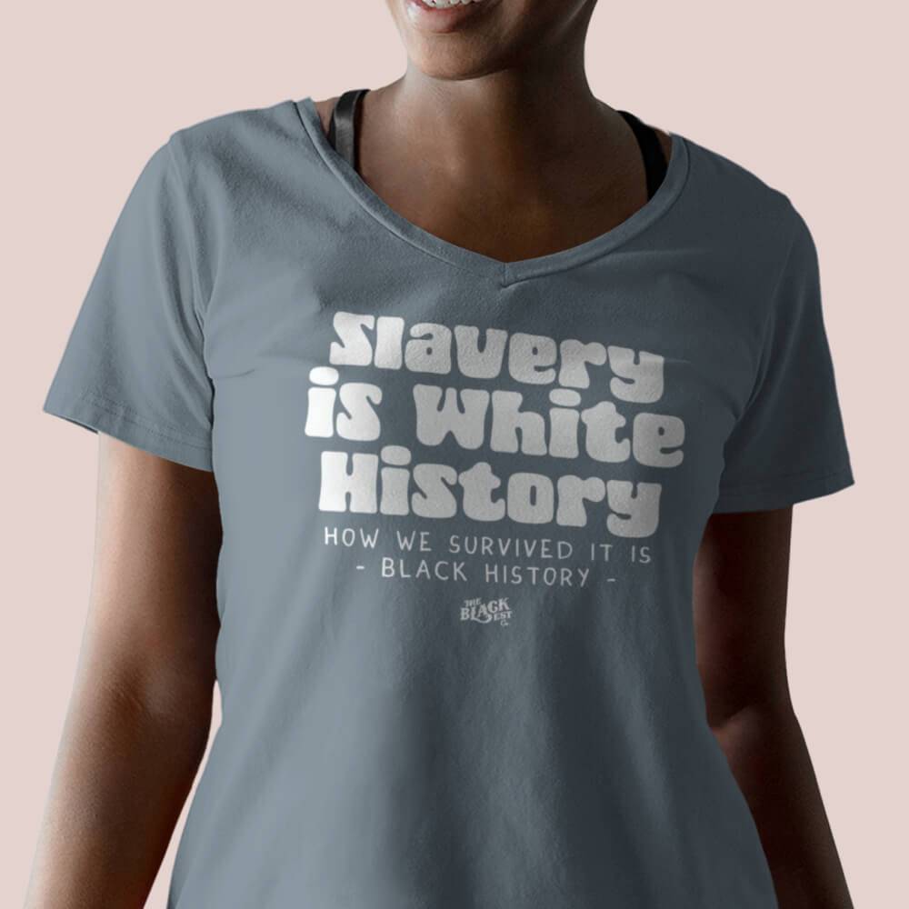 Woman wearing Slavery Is White History Womens V-neck t-shirt in soft blue, showcasing relaxed fit and cultural statement design.