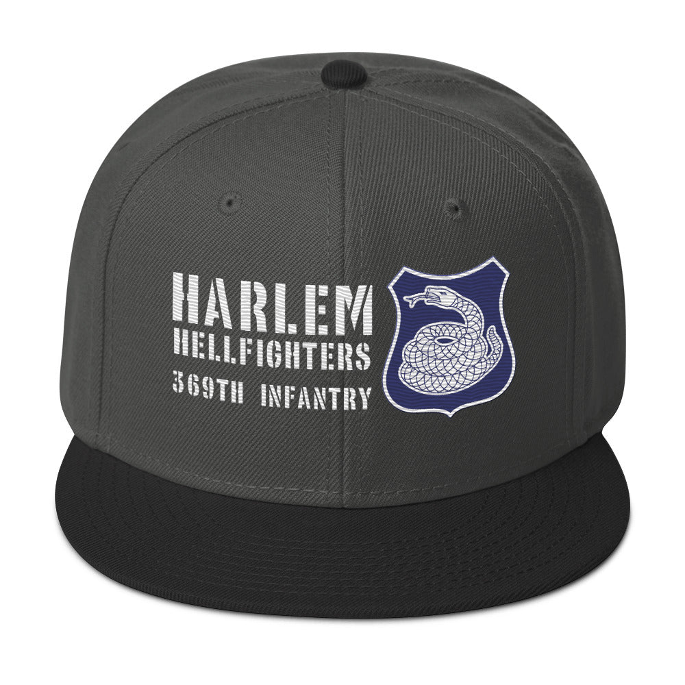 a grey hat with a white and purple rattlesnake crest on it with text that reads harlem hellfighters 369th infantry regiment