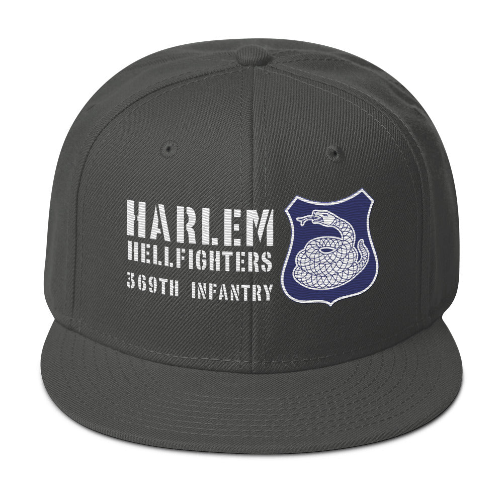 a grey hat with a white and purple rattlesnake crest on it with text that reads harlem hellfighters 369th infantry regiment