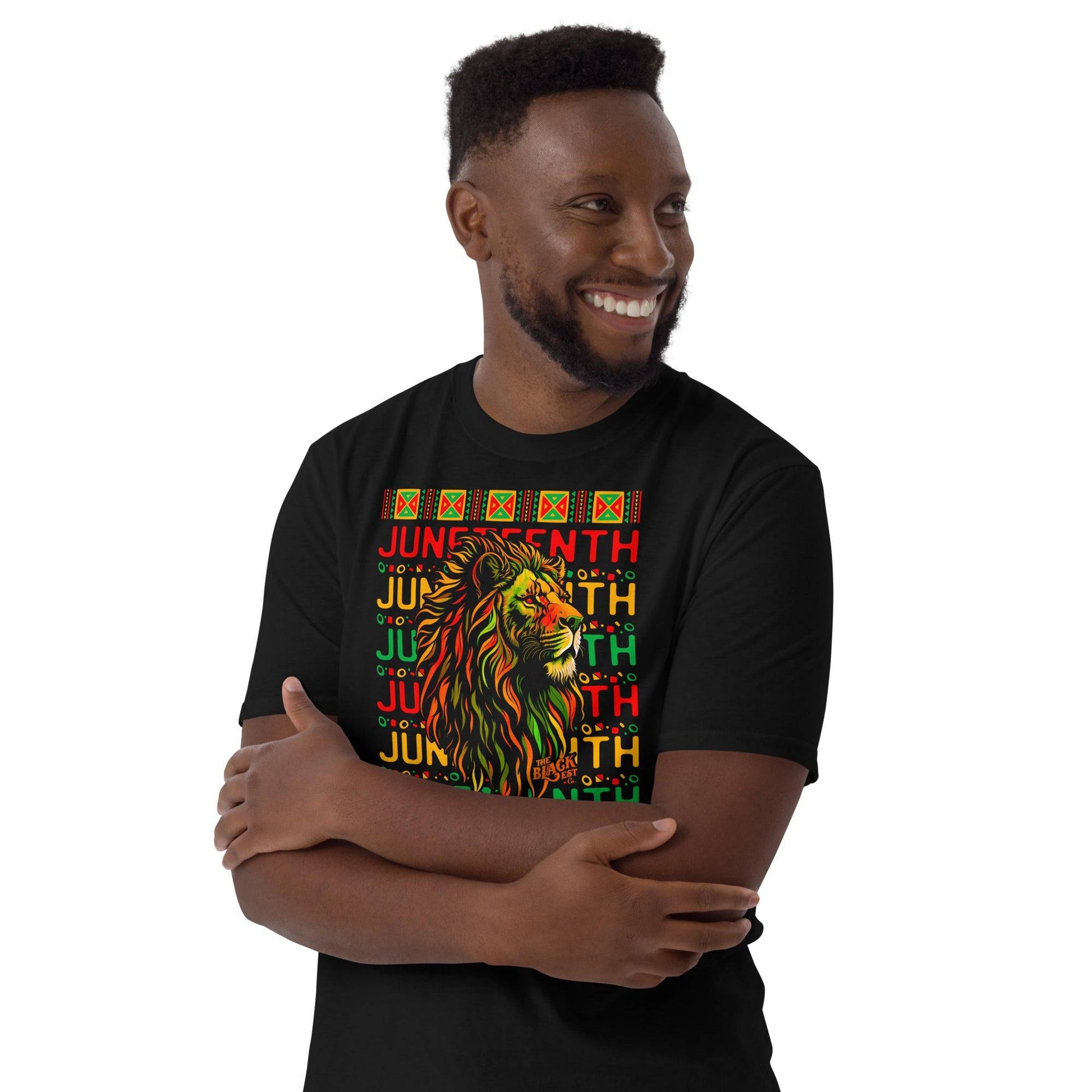 a man wearing a black shirt with a lion over juneteenth text repeating on it