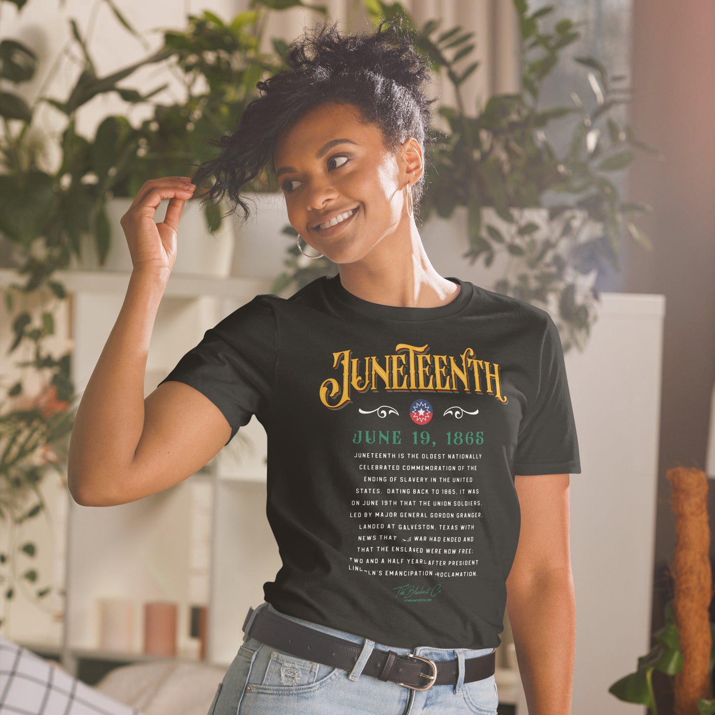 a woman wearing a black shirt with Juneteenth and the history of it written on it