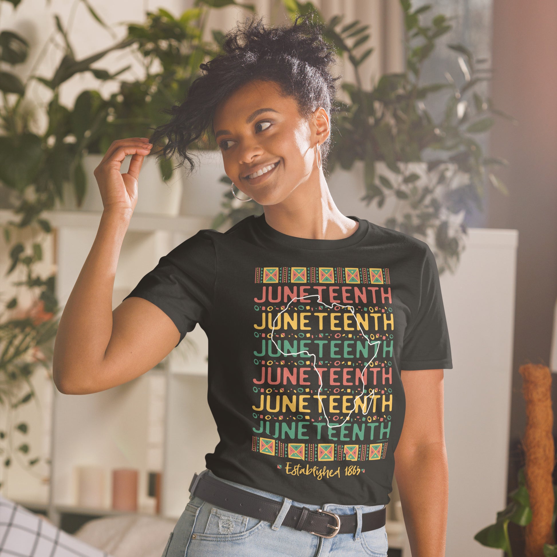 a woman wearing a t - shirt with the words Juneteenth Repeat Established 1865 on it
