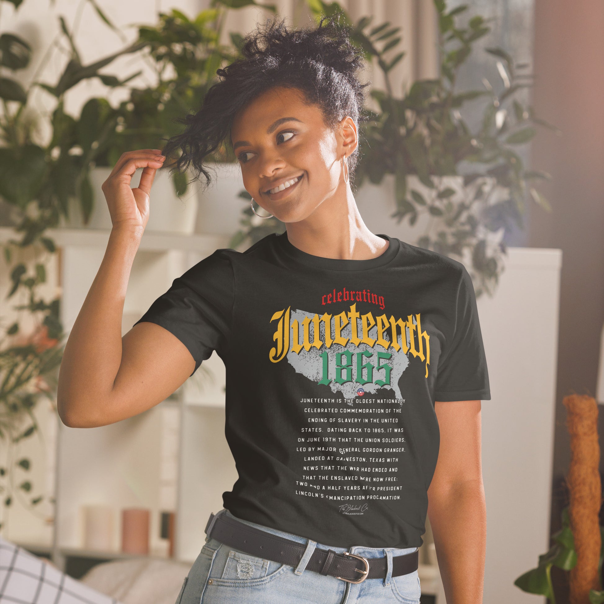 a woman wearing a black t - shirt with an image of a map of the united states and juneteenth on it