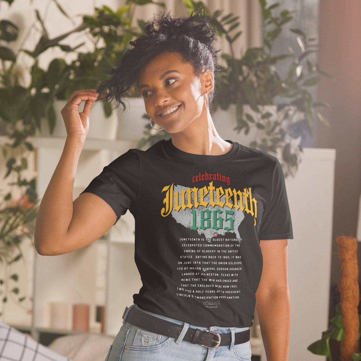 a woman wearing a black t - shirt with an image of a map of the united states and juneteenth on it