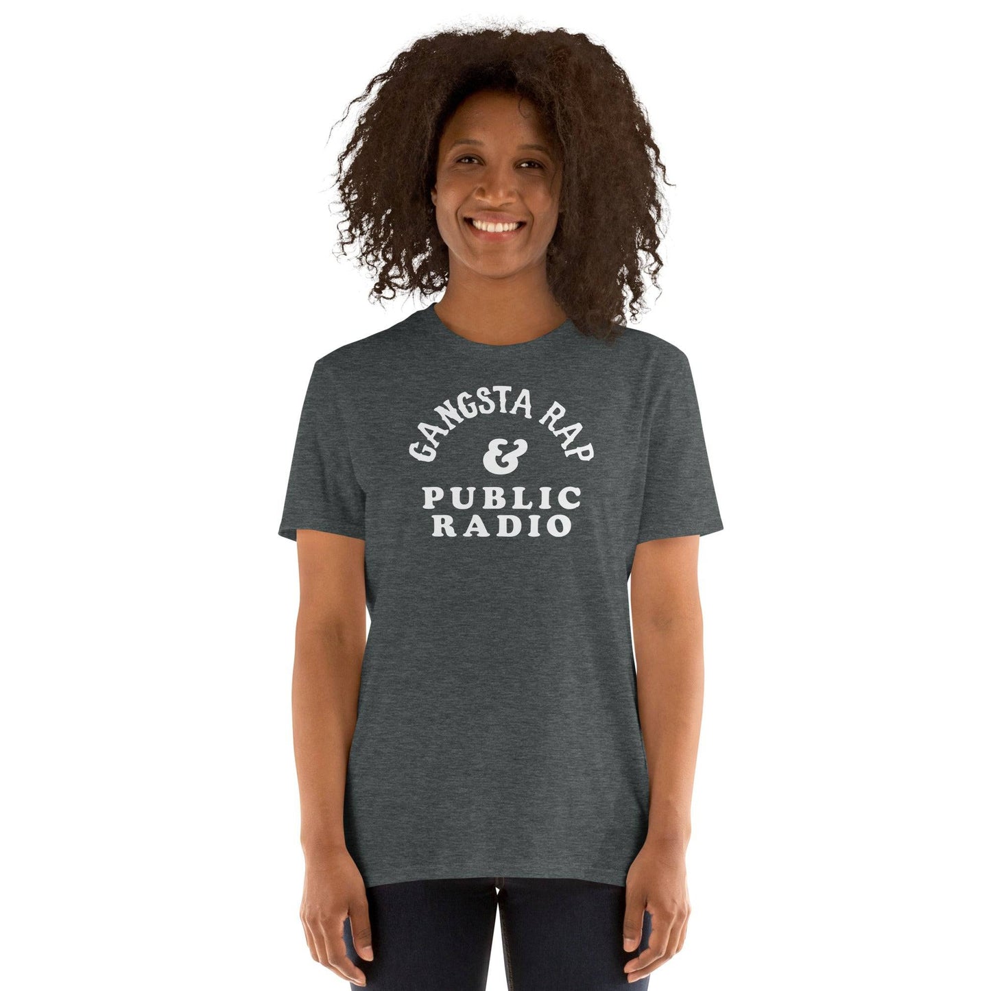 Woman wearing Gangsta Rap & Public Radio Softstyle Unisex T-Shirt in dark heather, perfect blend of street style and intellect.