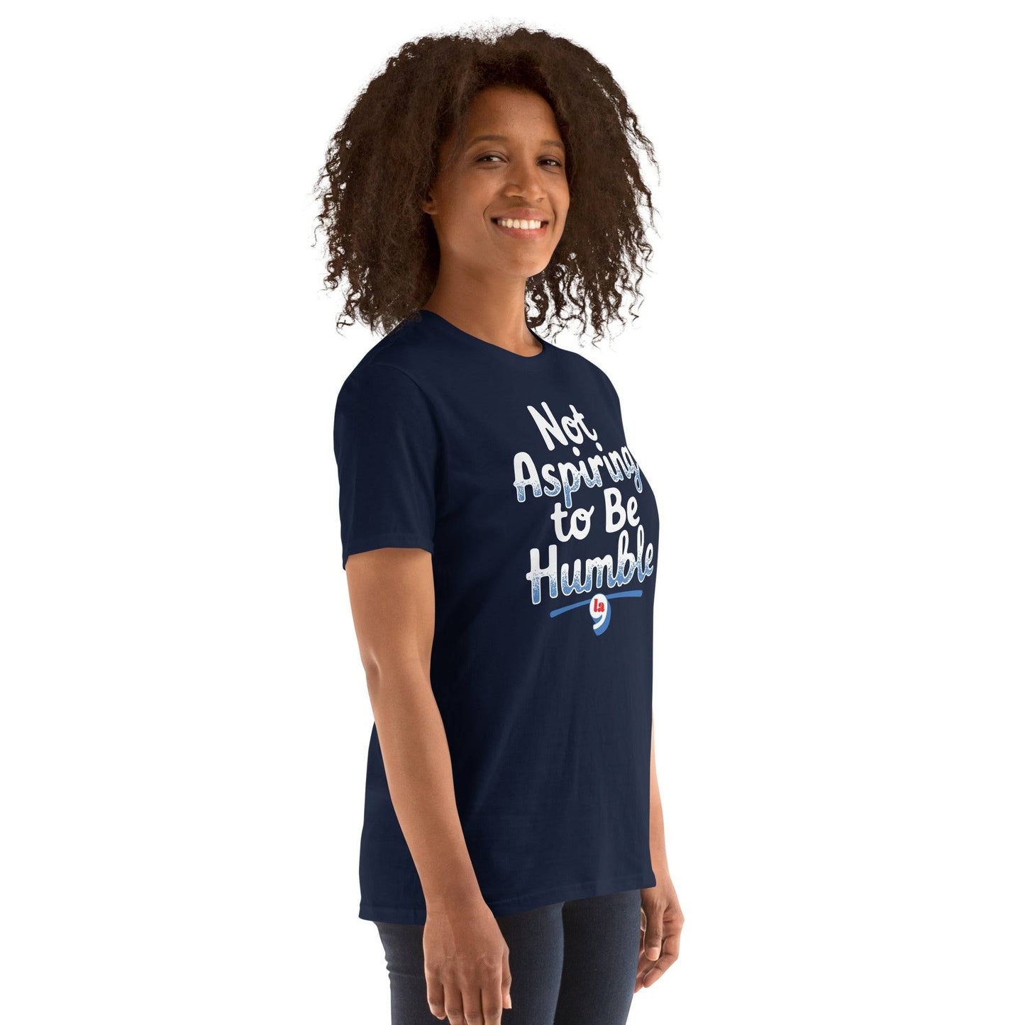 Side view of woman in navy 'Not Aspiring to Be Humble' tee