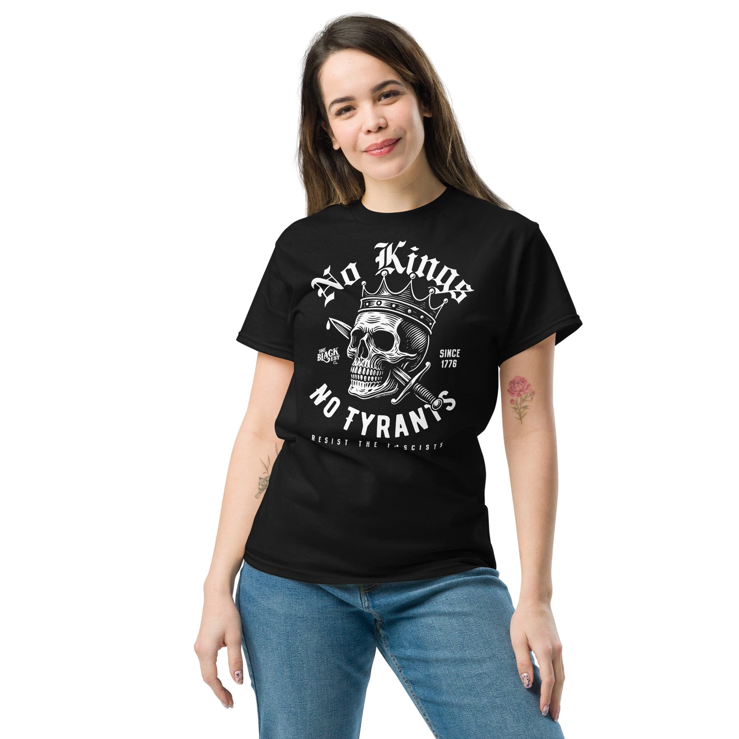 Woman modeling No Kings No Tyrants Skull Protest T-Shirt by TheBlackest Co., black unisex tee with rebellious skull graphic, cultural protest apparel.