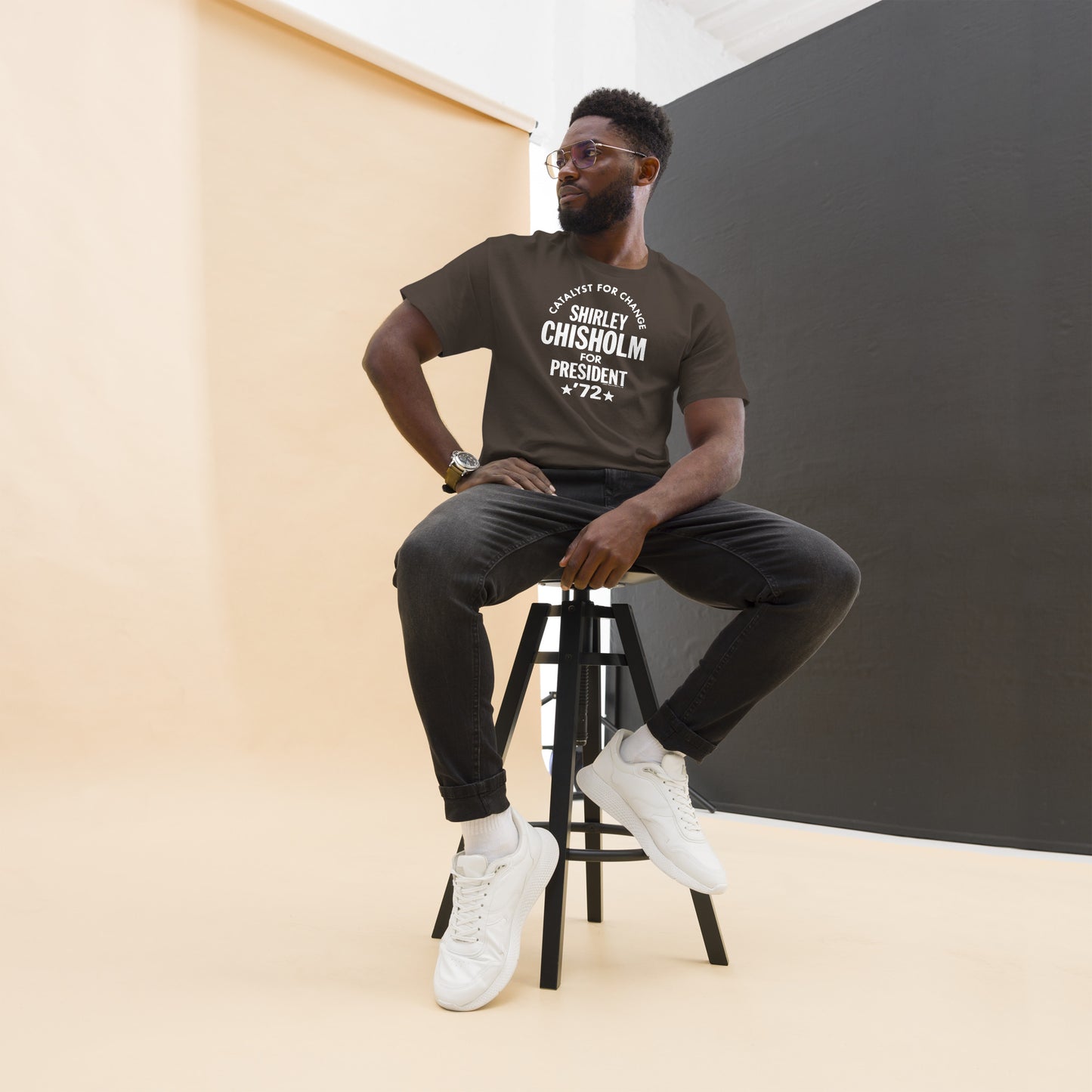Seated man in brown Shirley Chisholm 72 T-Shirt