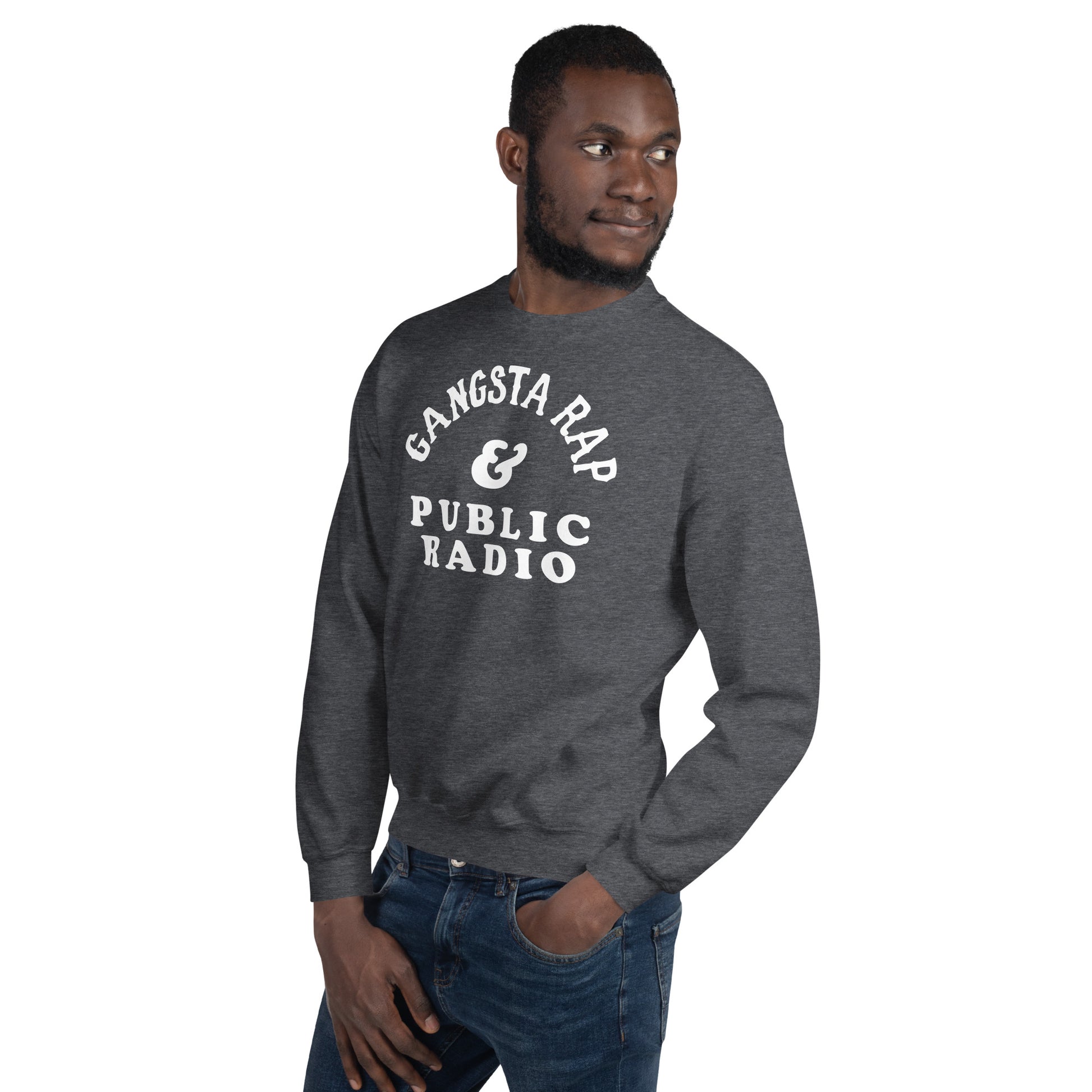 Man posing in Gangsta Rap And Public Radio Unisex Staple Sweatshirt, showing off the bold graphic and comfortable cotton blend material.