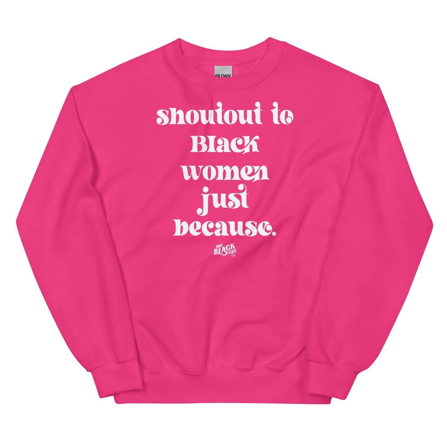 Vibrant pink unisex sweatshirt with white 'Shoutout To Black Women Just Because' lettering, bold statement piece from Black-owned apparel line.