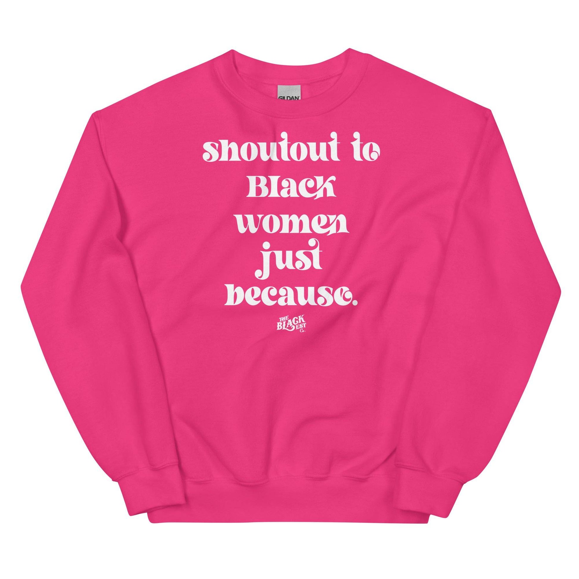 Vibrant pink unisex sweatshirt with white 'Shoutout To Black Women Just Because' lettering, bold statement piece from Black-owned apparel line.
