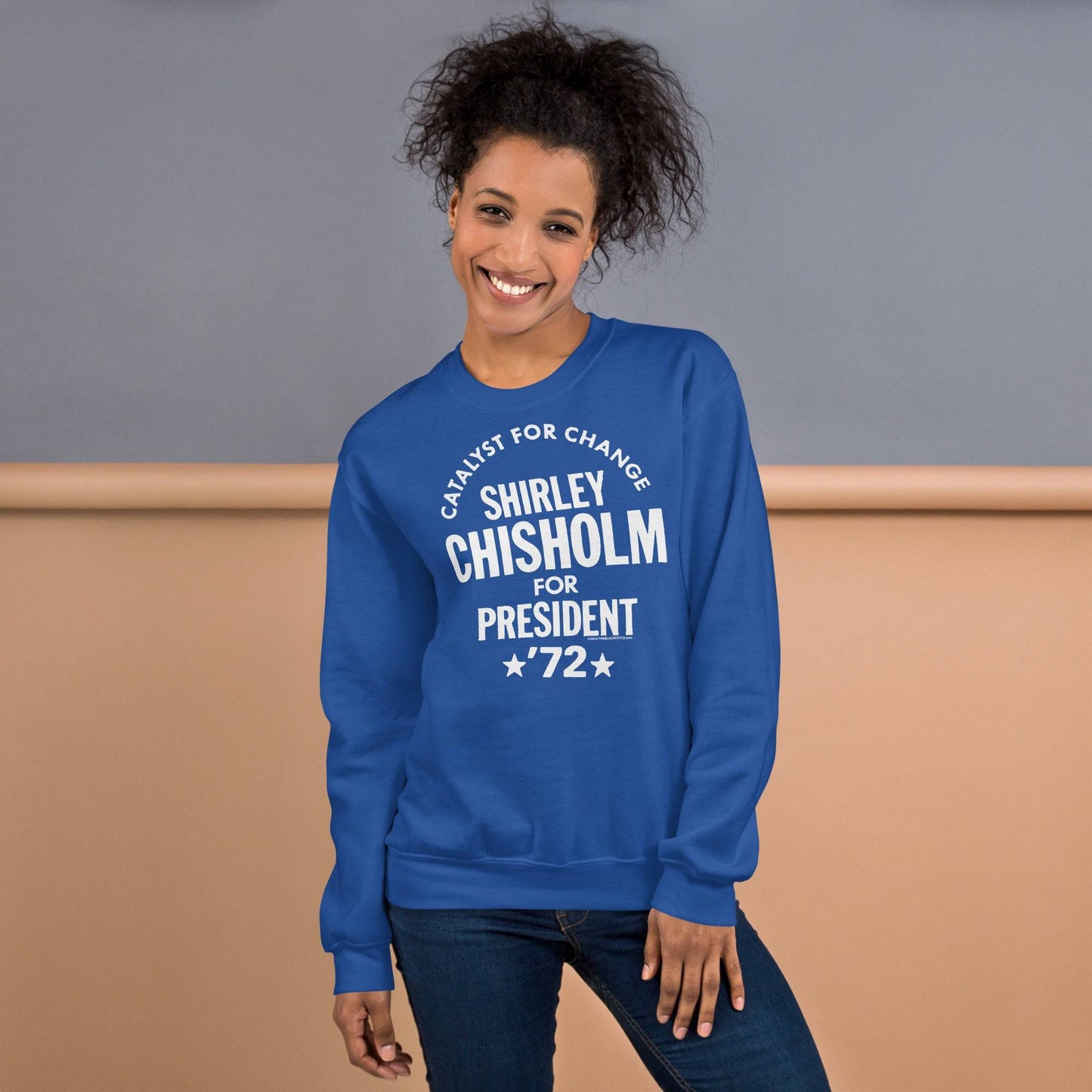 Woman wearing a blue 'Shirley Chisholm For President 72' sweatshirt, combining casual style with a tribute to a civil rights leader.