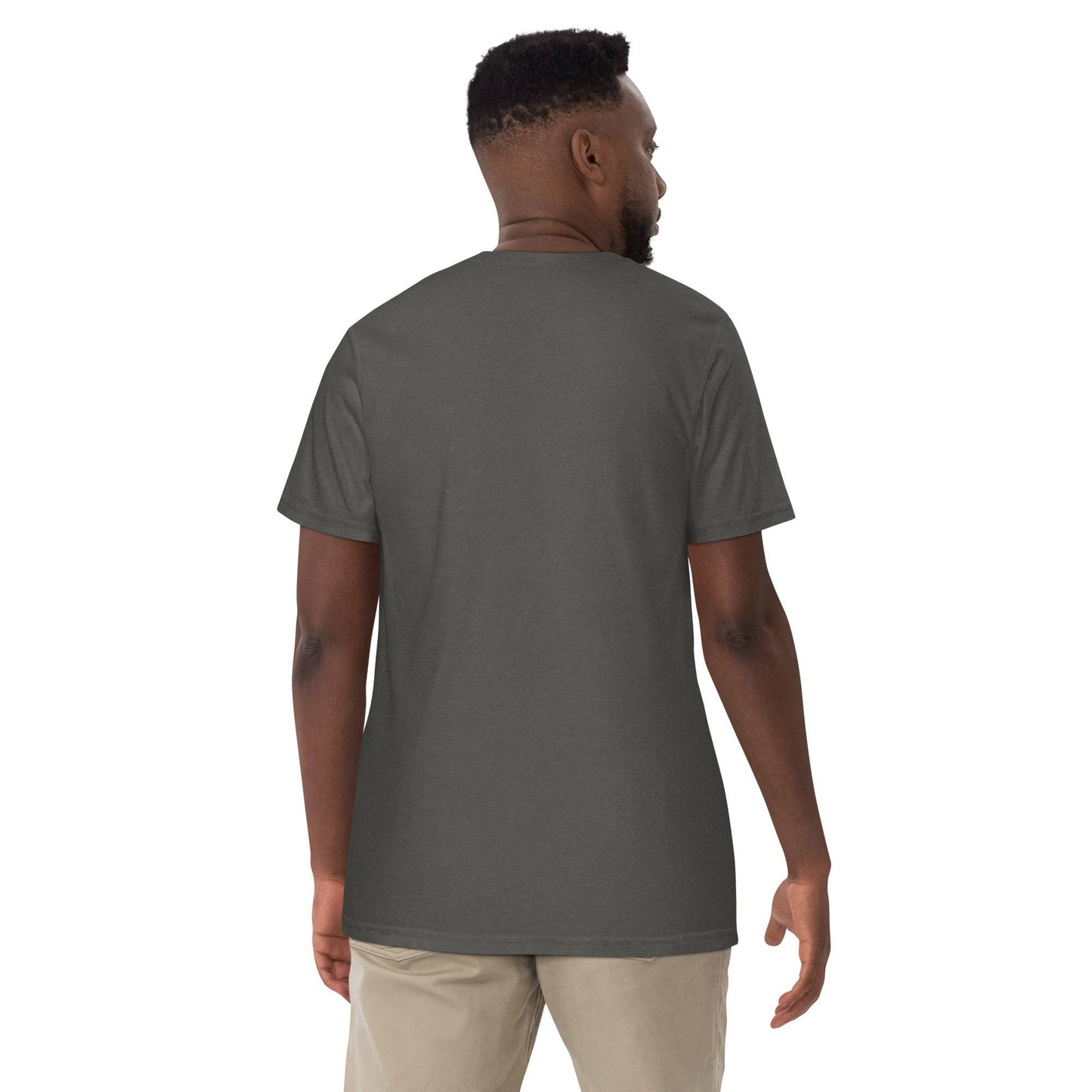 a man wearing a gray shirt and khaki pants