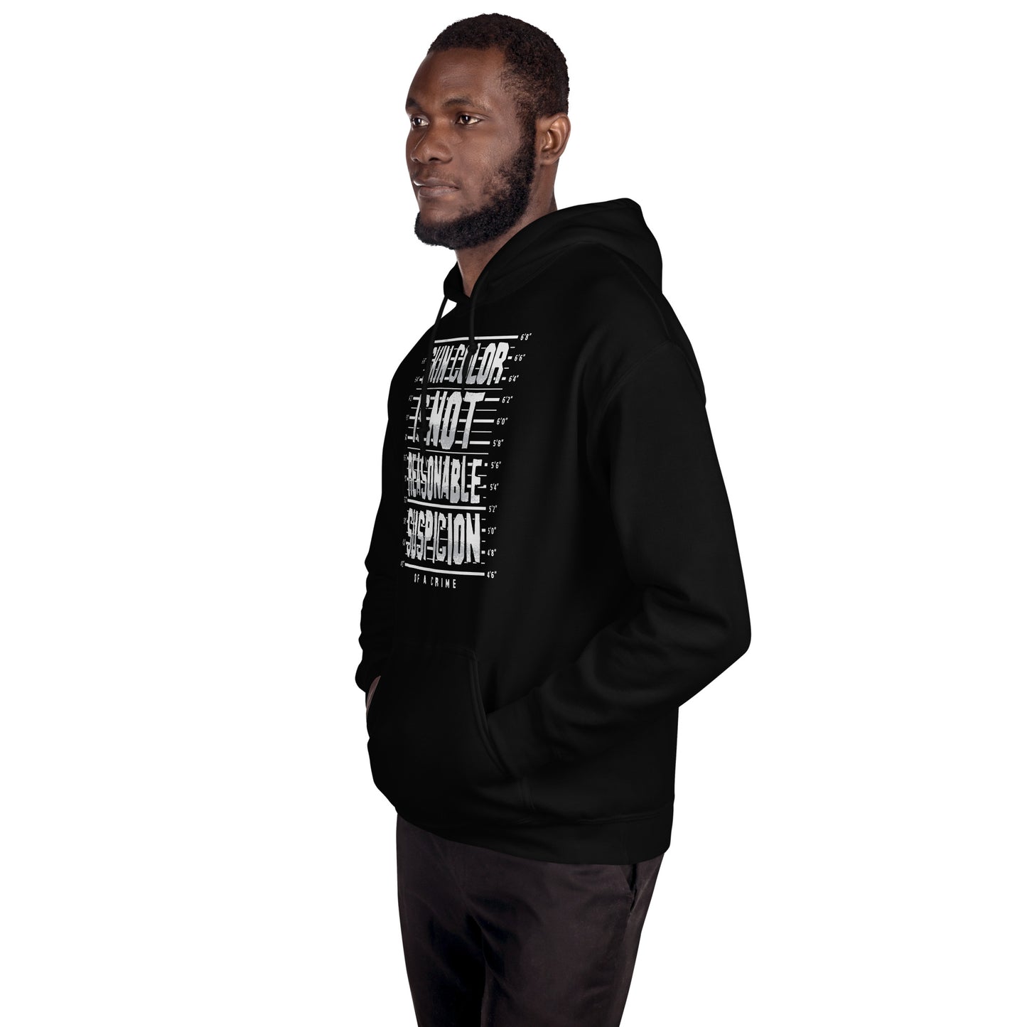 Man wearing Skin Color Is Not A Crime Unisex Hoodie by TheBlackest Co., showcasing activist streetwear in black with bold message print.