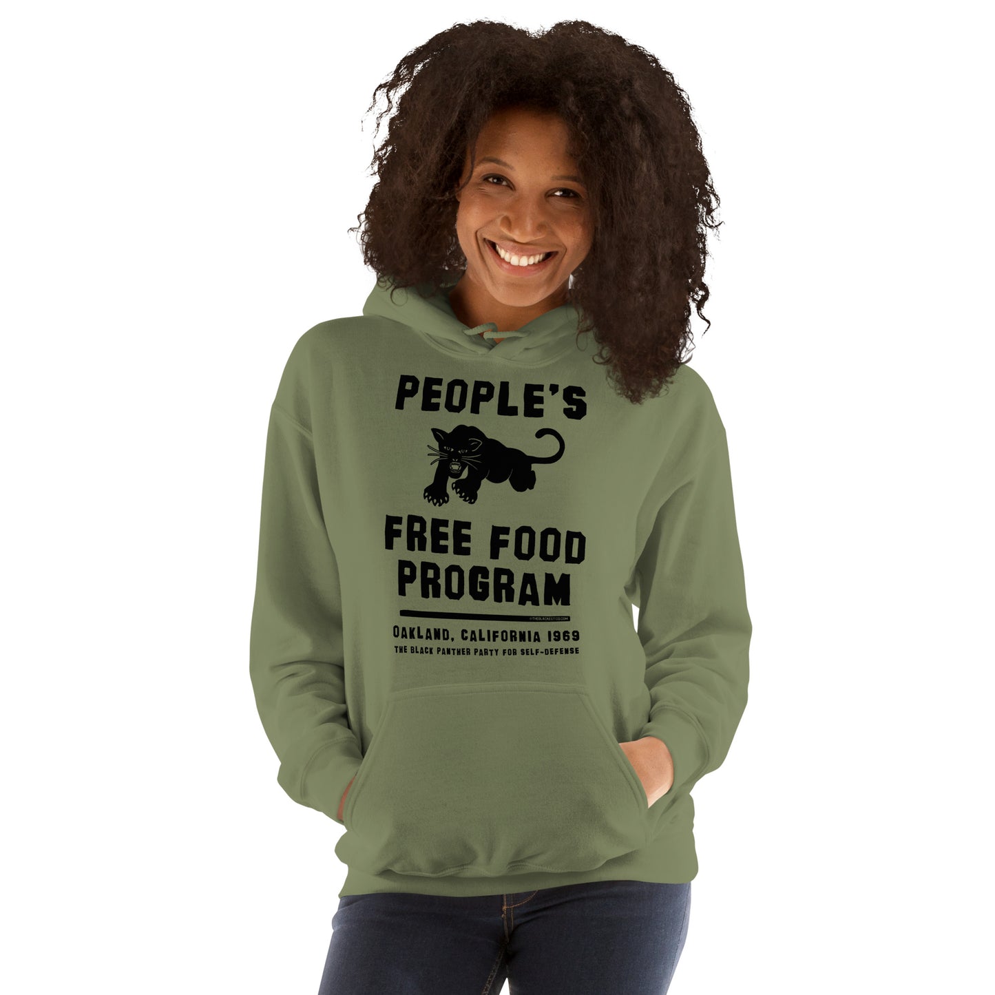 Smiling woman in green People's Free Food Program hoodie.