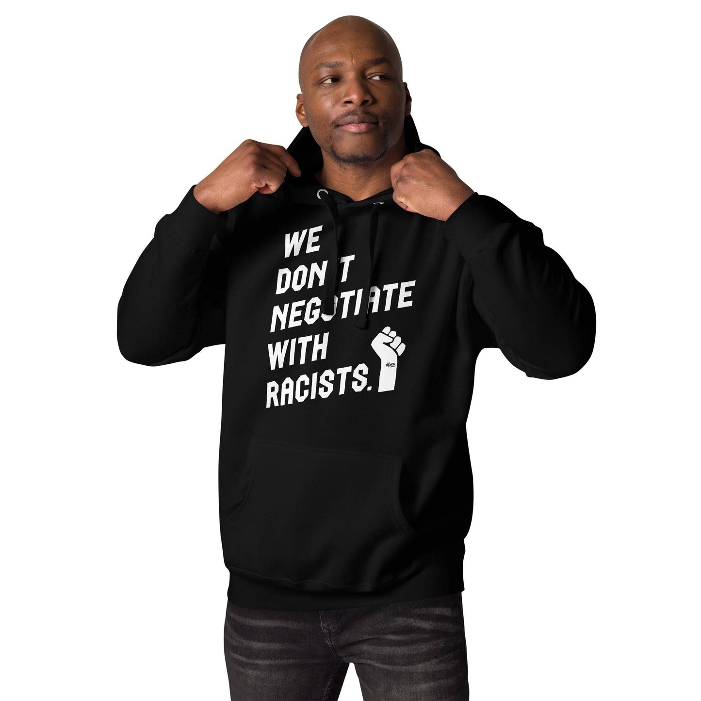 Man wearing black hoodie with anti-racist message