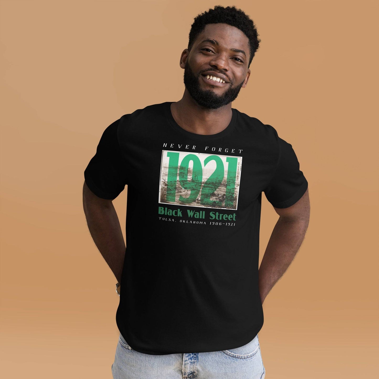 Man wearing Black Wall Street 1921 t-shirt, smiling.