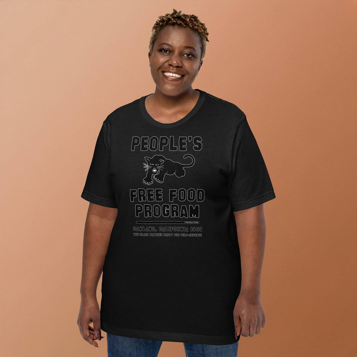 Black On Black BPP Free Food Program Fashion Unisex T-shirt worn by smiling woman, showcasing cultural empowerment design in relaxed fit.