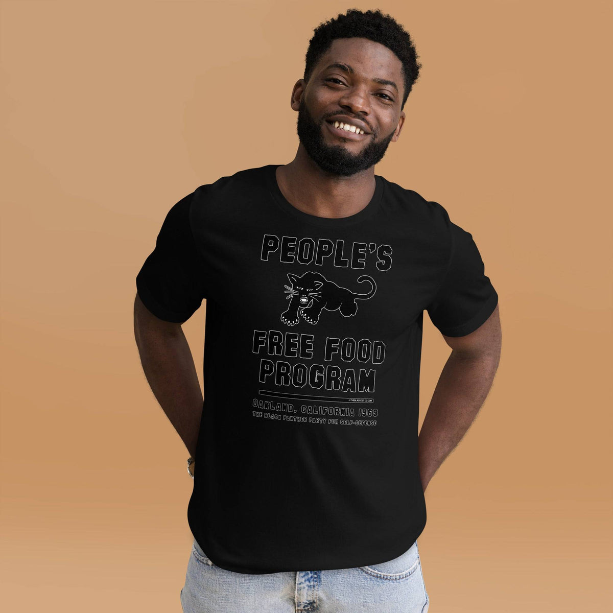 Black On Black BPP Free Food Program Fashion Unisex T-shirt worn by smiling man, emphasizing bold graphic and soft cotton fit.