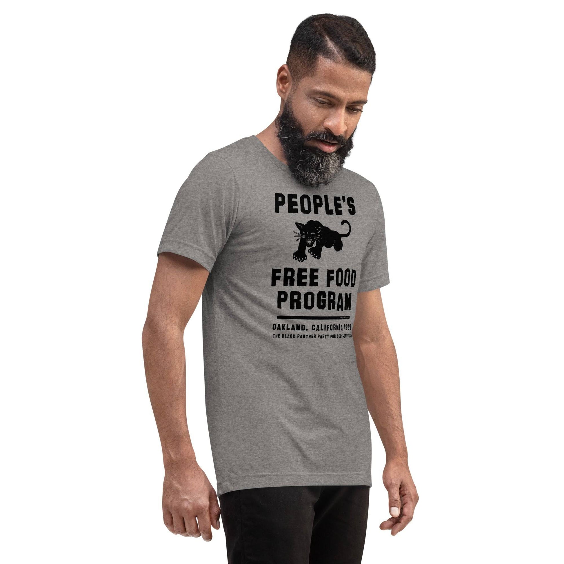 Man modeling gray BPP People's Free Food Program Unisex Tri-Blend T-Shirt with iconic black panther logo and historical Oakland 1969 print.