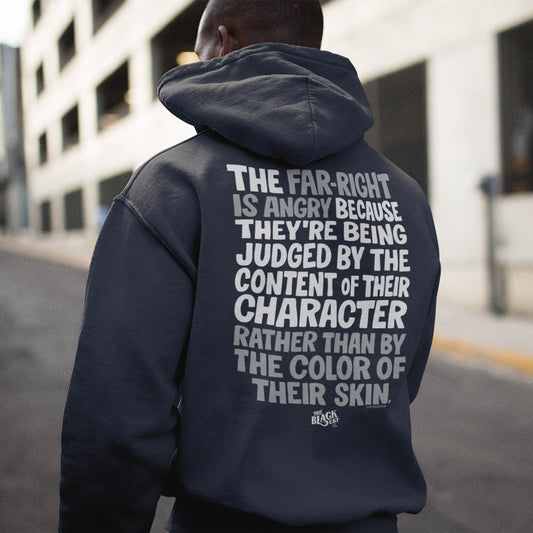 Why The Far Right Is Angry Hoodie by TheBlackest Co. in charcoal gray with bold back print quote, worn outdoors in urban setting.