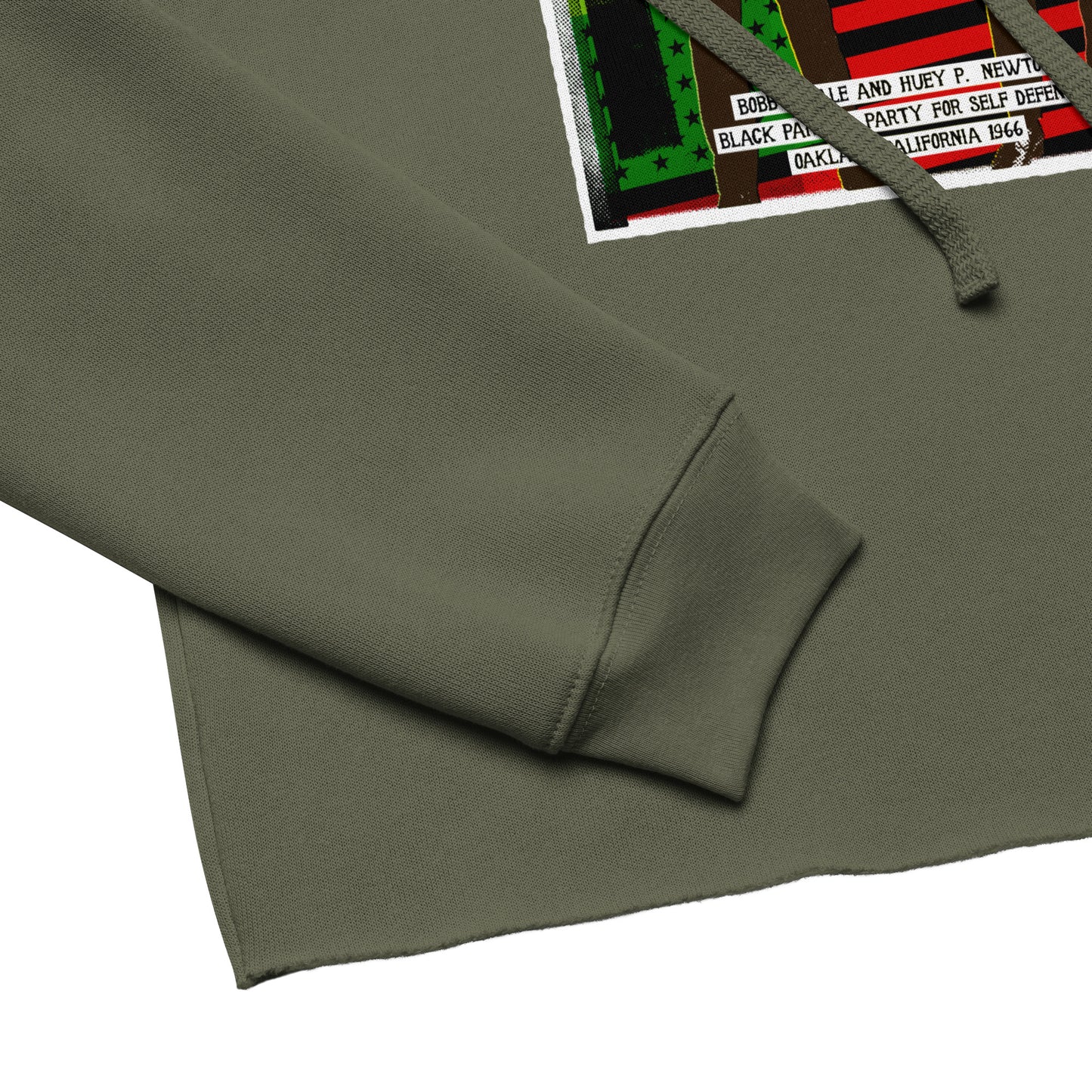 Close-up of The Black Panther Party BPP Storefront Crop Hoodie sleeve and hem, showing soft fabric texture and detailed BPP graphic print.