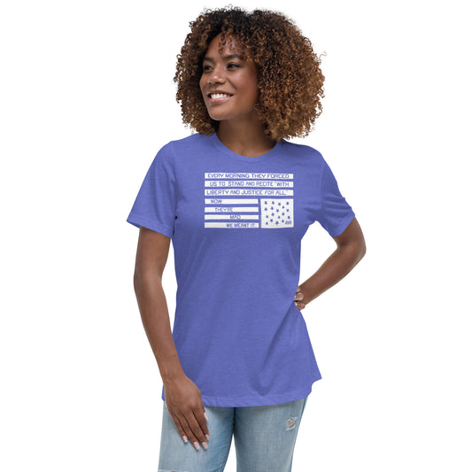 Woman wearing a blue relaxed fit protest t-shirt with quote and flag design, casual social justice apparel, model smiling