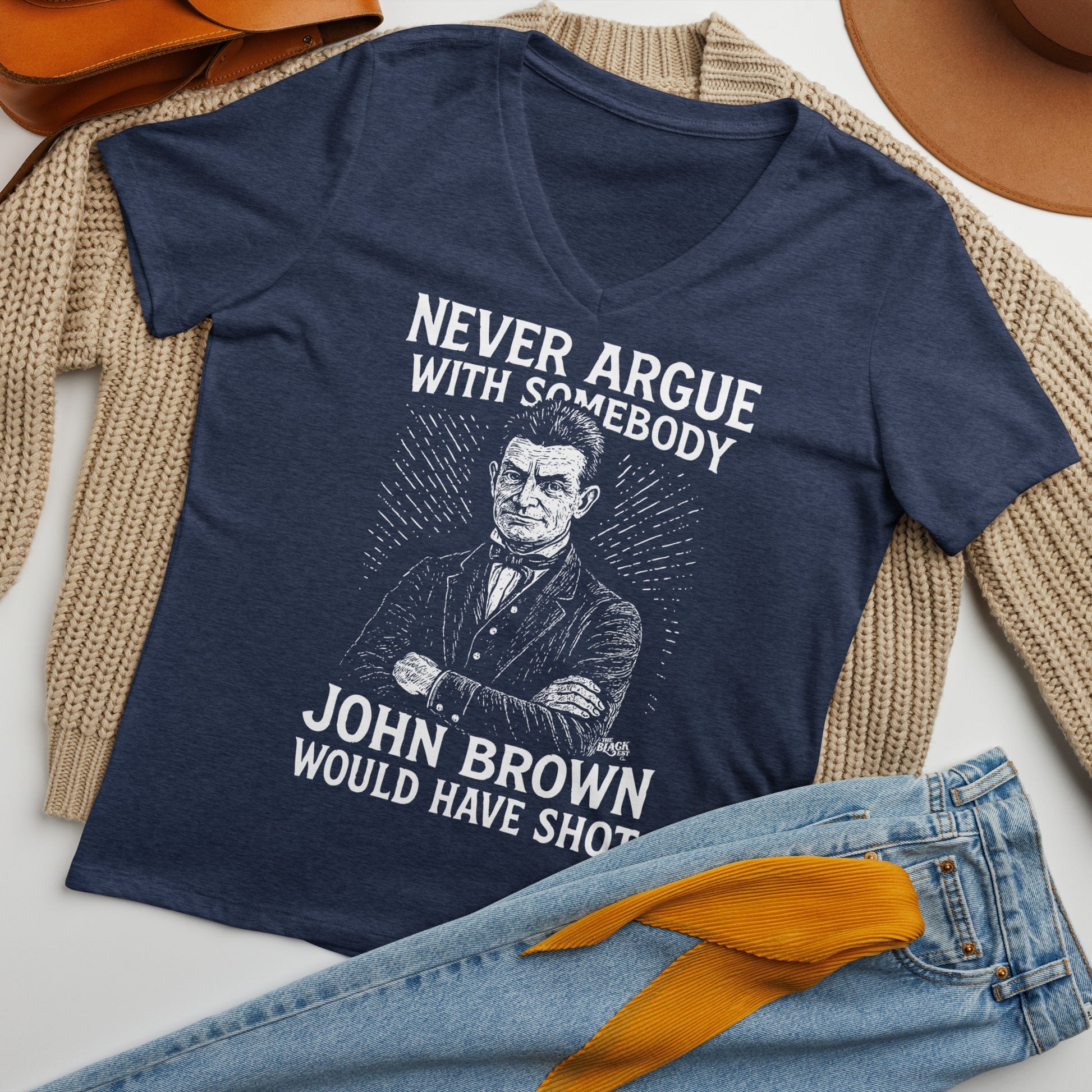 Flat lay of Never Argue With Somebody John Brown Womens Relaxed V-Neck styled with jeans and cardigan, showcasing casual outfit inspiration.