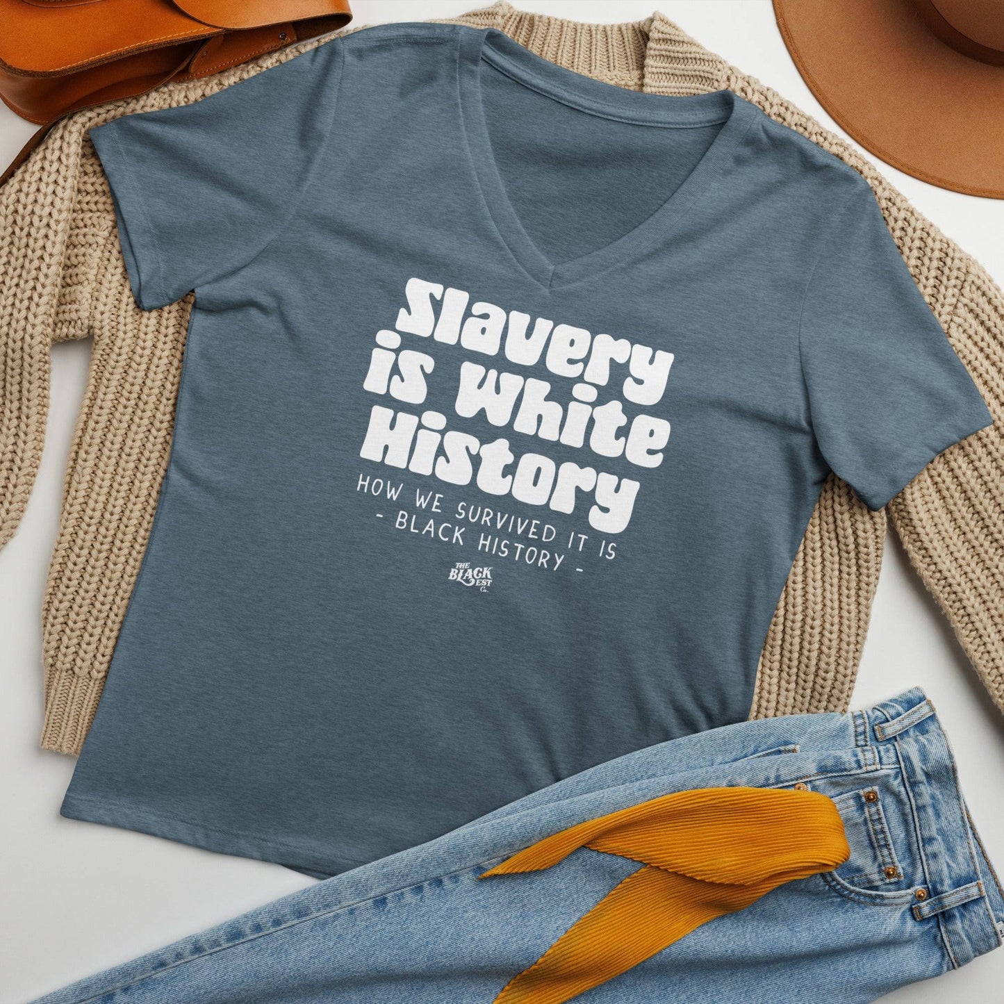 Slavery Is White History Womens V-neck laid flat with accessories, highlighting soft fabric and stylish relaxed fit for women.