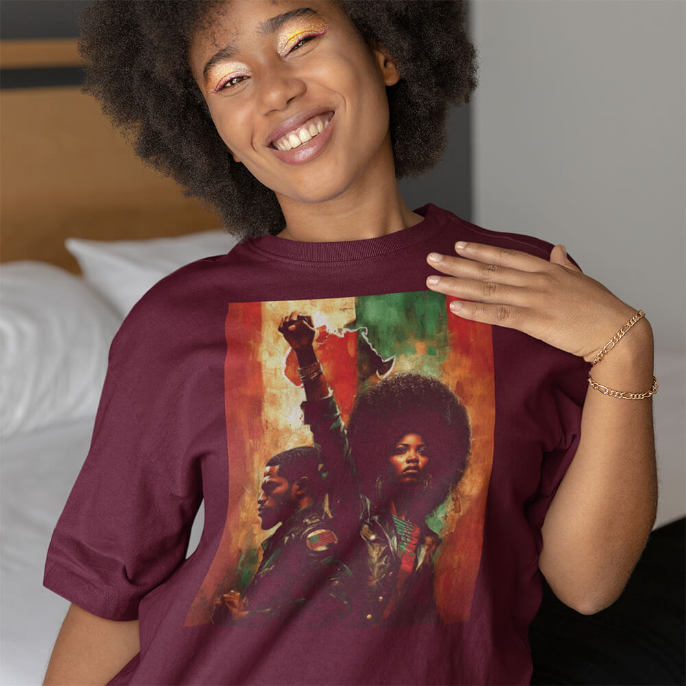 young lady in maroon t-shirt with Pan African couple and raised fist graphic