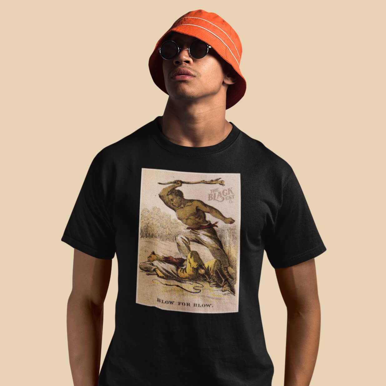 Blow For Blow The Slave in 1863 Card Series T-Shirt featuring a historic graphic of Black resistance, worn by a model in a red bucket hat and sunglasses.