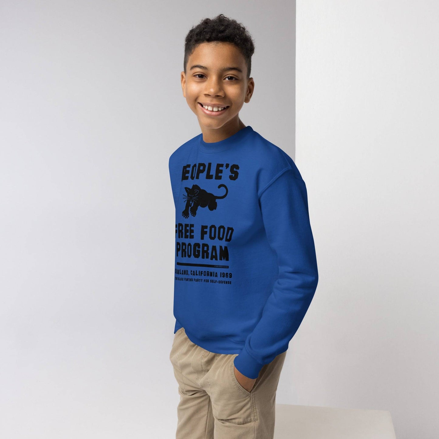 Boy wearing blue BPP People's Free Food Program Youth Sweatshirt