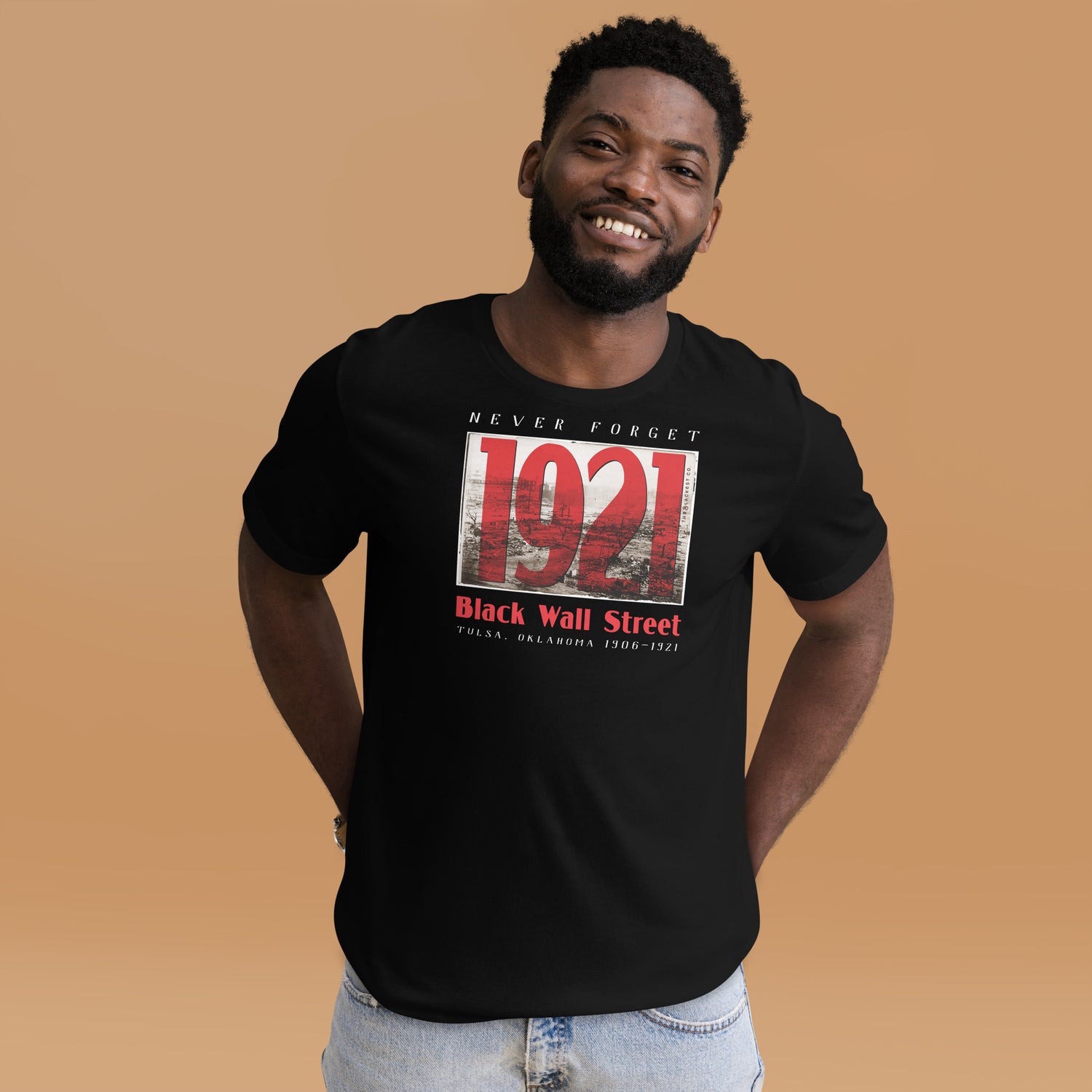 young smiling black man wearing black wall street 1921 t-shirt
