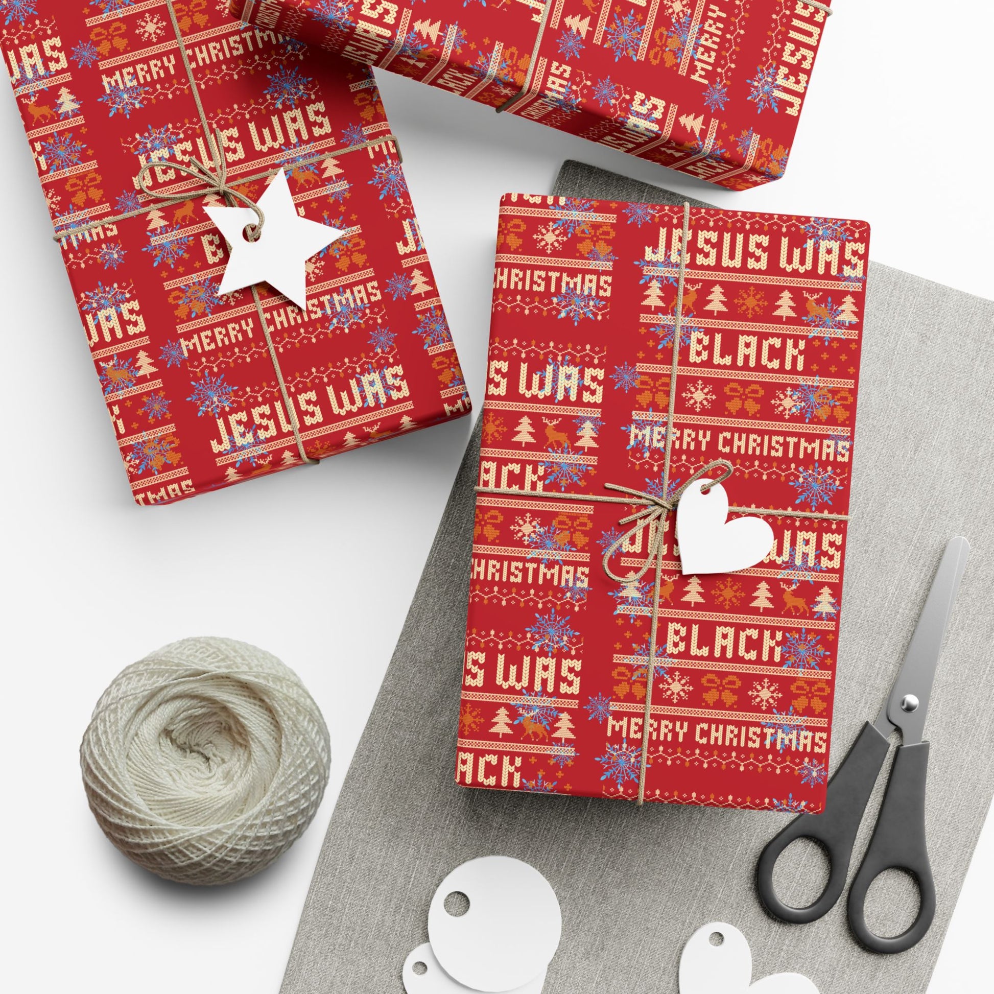 Jesus Was Black Merry Christmas red wrapping paper on boxed gifts with festive patterns, ideal for bold holiday gift presentation.