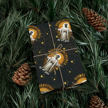 Gift wrapped in Black Jesus Disappointments All Of You Christmas Gift Wrap on pine branches, combining humor and festive style for holiday gifting.