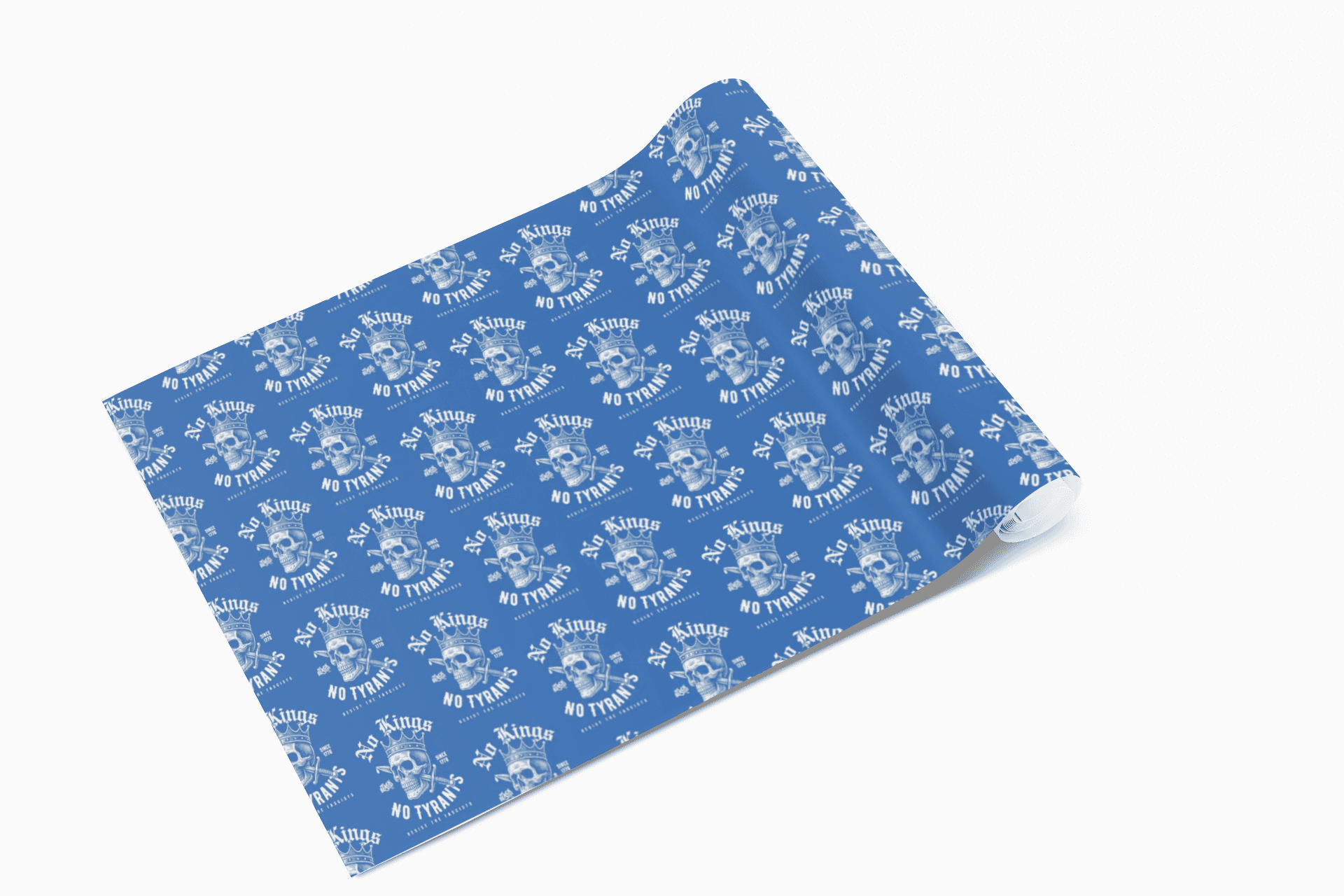 Partially unrolled No Kings No Tyrants Christmas Gift Wrapping Paper by TheBlackest Co., highlighting its bold skull and protest print on blue.