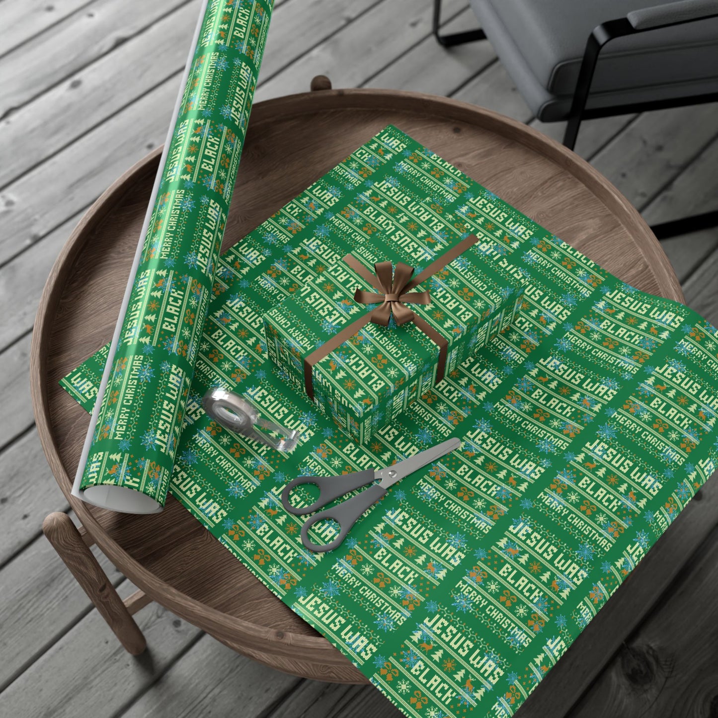 Jesus Was Black Merry Christmas green wrapping paper roll and wrapped gifts on a wooden table, showcasing bold and inclusive holiday decor.
