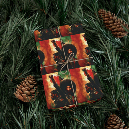 PanAfrican Christmas Wrapping Paper with raised fist design, wrapped around a holiday gift placed among pine needles and pinecones for seasonal decor.